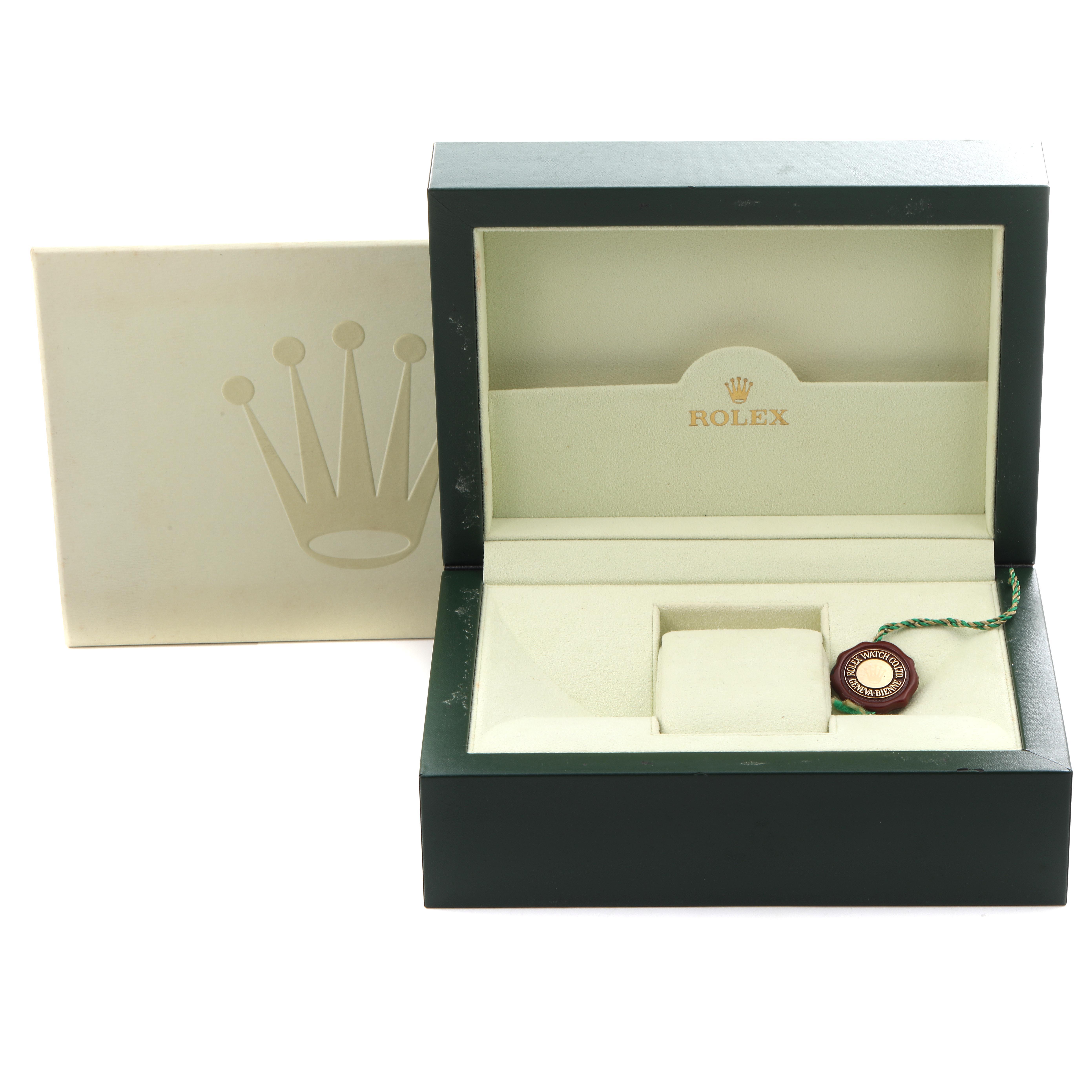 The image features an open Rolex Daytona 116523 Men's Steel and Gold (two tone) White Dial 116523 Men's Steel and Gold (two tone) White Dial watch box, showing the interior with a tag inside.