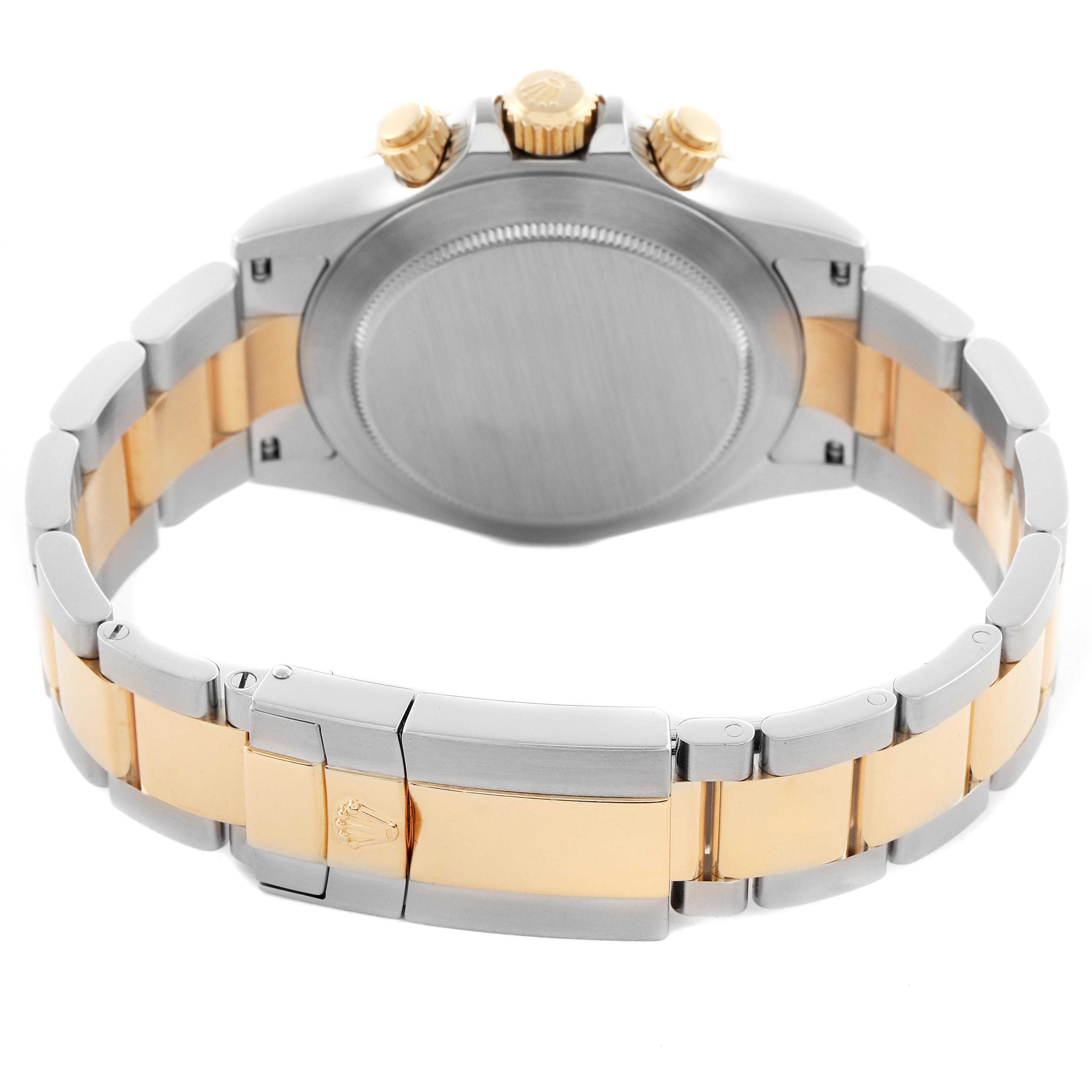 The Rolex Daytona 116523 Men's Steel and Gold (two tone) White Dial 116523 Men's Steel and Gold (two tone) White Dial watch is shown from the back, highlighting the case back, crown, and bracelet clasp.
