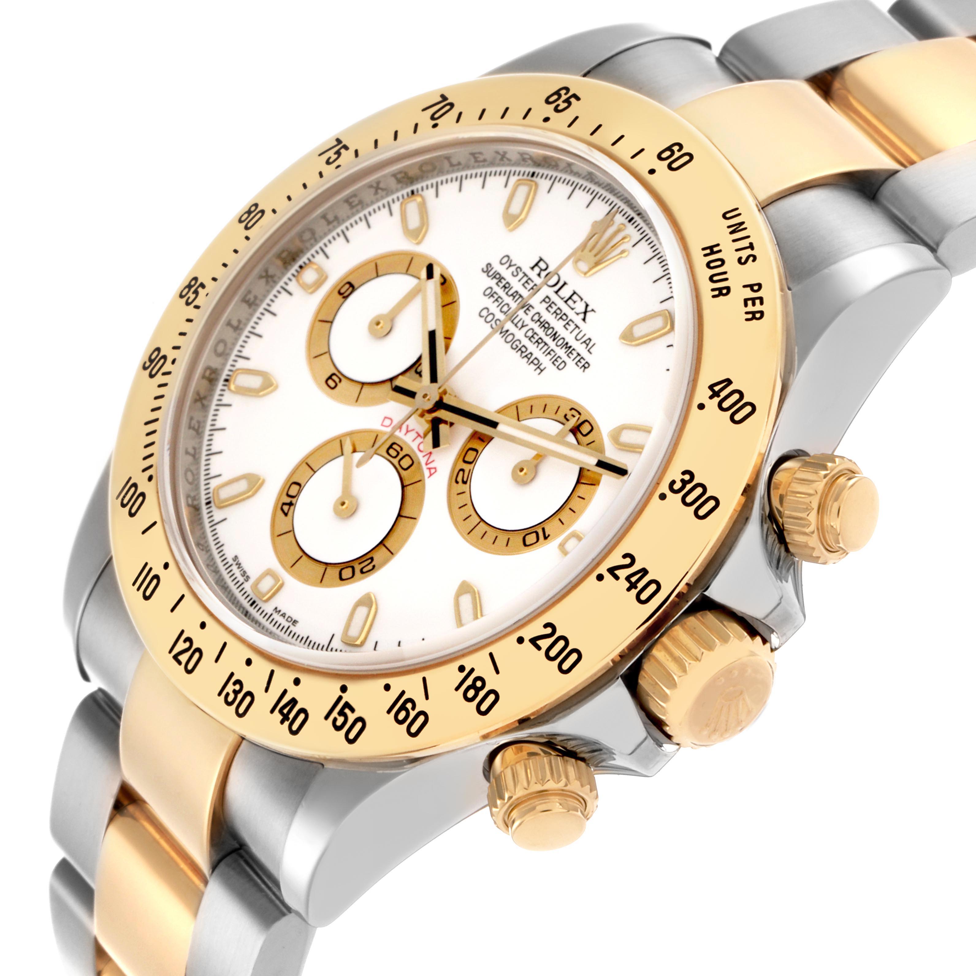 This Rolex Daytona 116523 Men's Steel and Gold (two tone) White Dial 116523 Men's Steel and Gold (two tone) White Dial watch is shown at a three-quarter angle, highlighting its gold bezel, crown, and chronograph pushers.