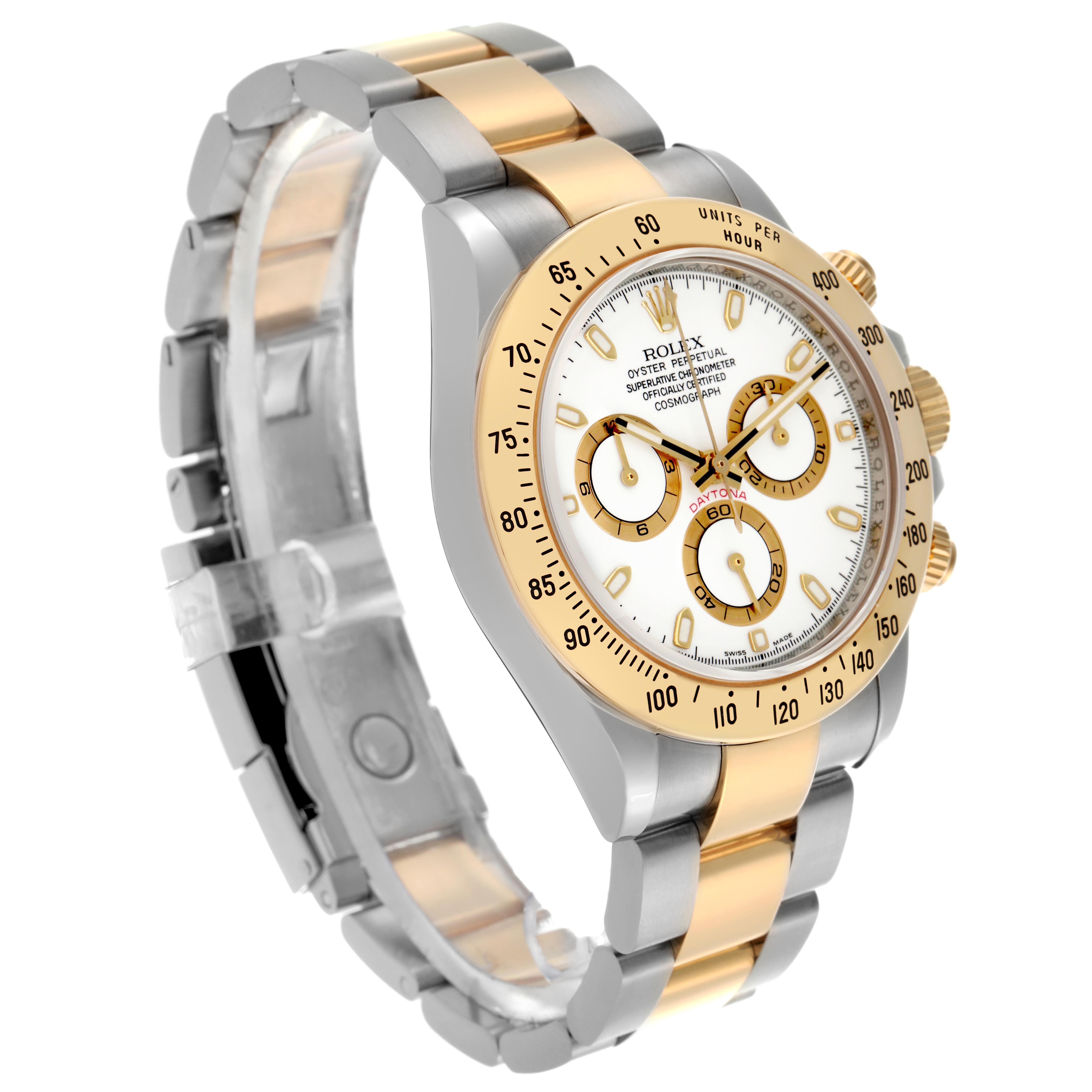 The Rolex Daytona 116523 Men's Steel and Gold (two tone) White Dial 116523 Men's Steel and Gold (two tone) White Dial watch is shown at a three-quarter angle, displaying its bezel, dial, and two-tone bracelet.