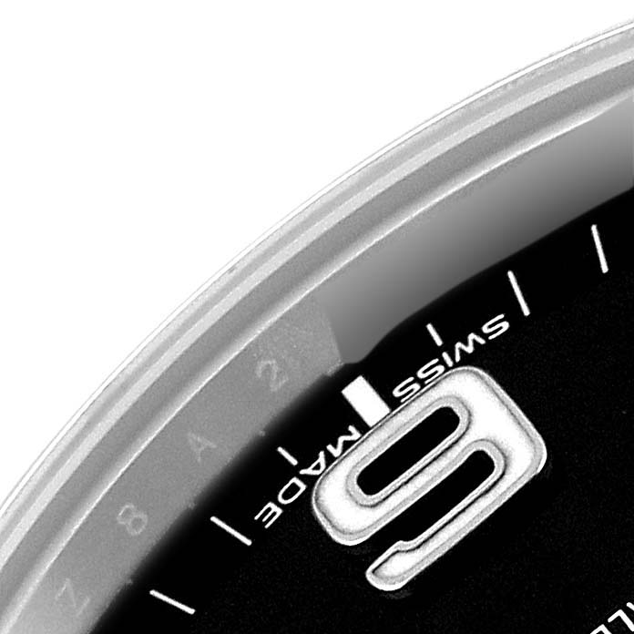 The image shows a close-up of the dial on a Rolex Explorer 214270 Men's Stainless Steel Black Dial 214270 Men's Stainless Steel Black Dial, highlighting the numeral 9 and part of the text "Swiss Made."