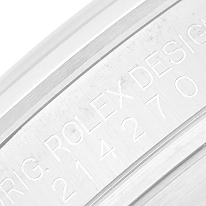 The image shows a close-up of the engraved case back edge of a Rolex Explorer 214270 Men's Stainless Steel Black Dial 214270 Men's Stainless Steel Black Dial watch.