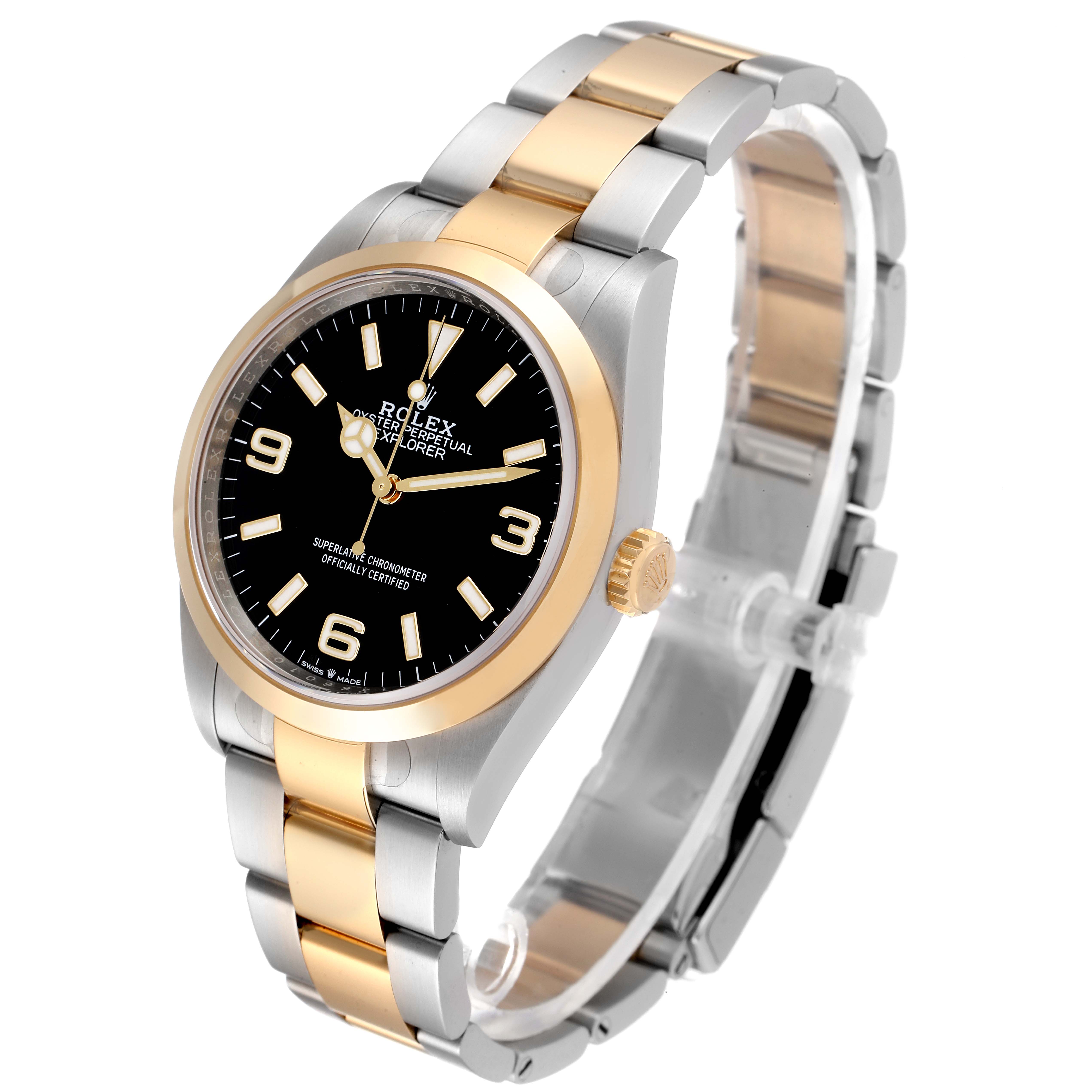 The Rolex Explorer 124273 Men
s Steel and Gold (two tone) Black Dial 124273 Men
s Steel and Gold (two tone) Black Dial watch is pictured at a slight angle showing the face, bezel, crown, and two-tone bracelet.