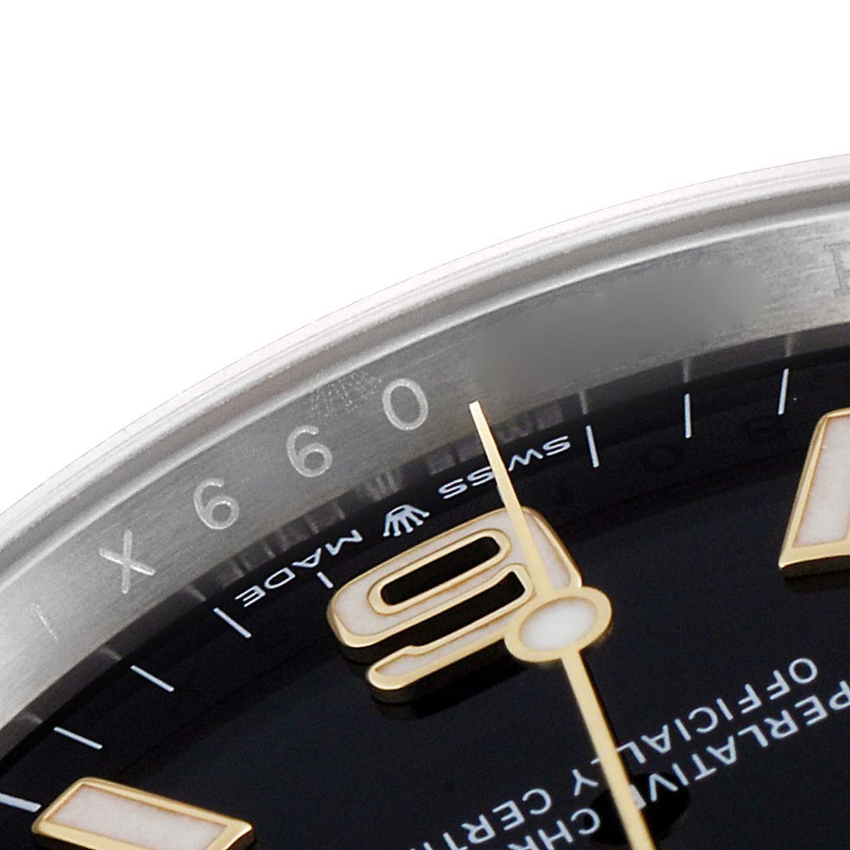 The angle shows a close-up of the dial, bezel, and part of the numeral 
9
 on the Rolex Explorer 124273 Men
s Steel and Gold (two tone) Black Dial 124273 Men
s Steel and Gold (two tone) Black Dial watch.
