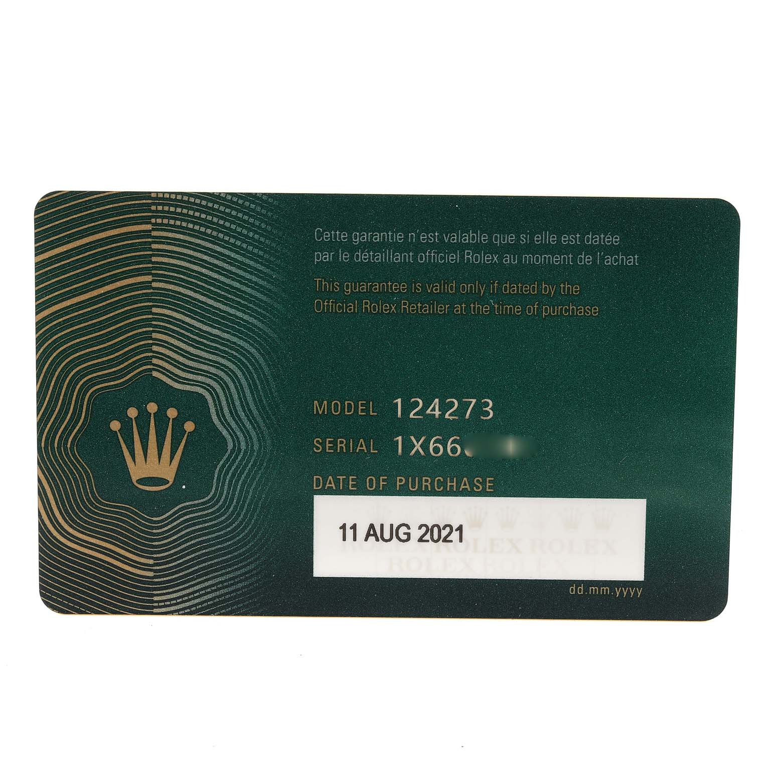 The image shows the guarantee card for a Rolex Explorer 124273 Men
s Steel and Gold (two tone) Black Dial 124273 Men
s Steel and Gold (two tone) Black Dial model 124273, including its serial number and date of purchase.