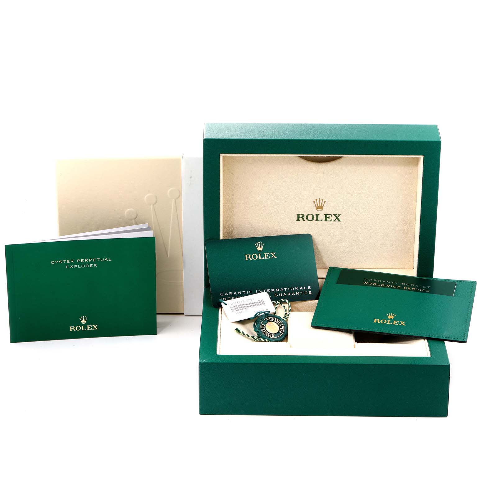 The image shows the packaging and documents for a Rolex Explorer 124273 Men
s Steel and Gold (two tone) Black Dial 124273 Men
s Steel and Gold (two tone) Black Dial, including the box, manuals, tags, and warranty cards.