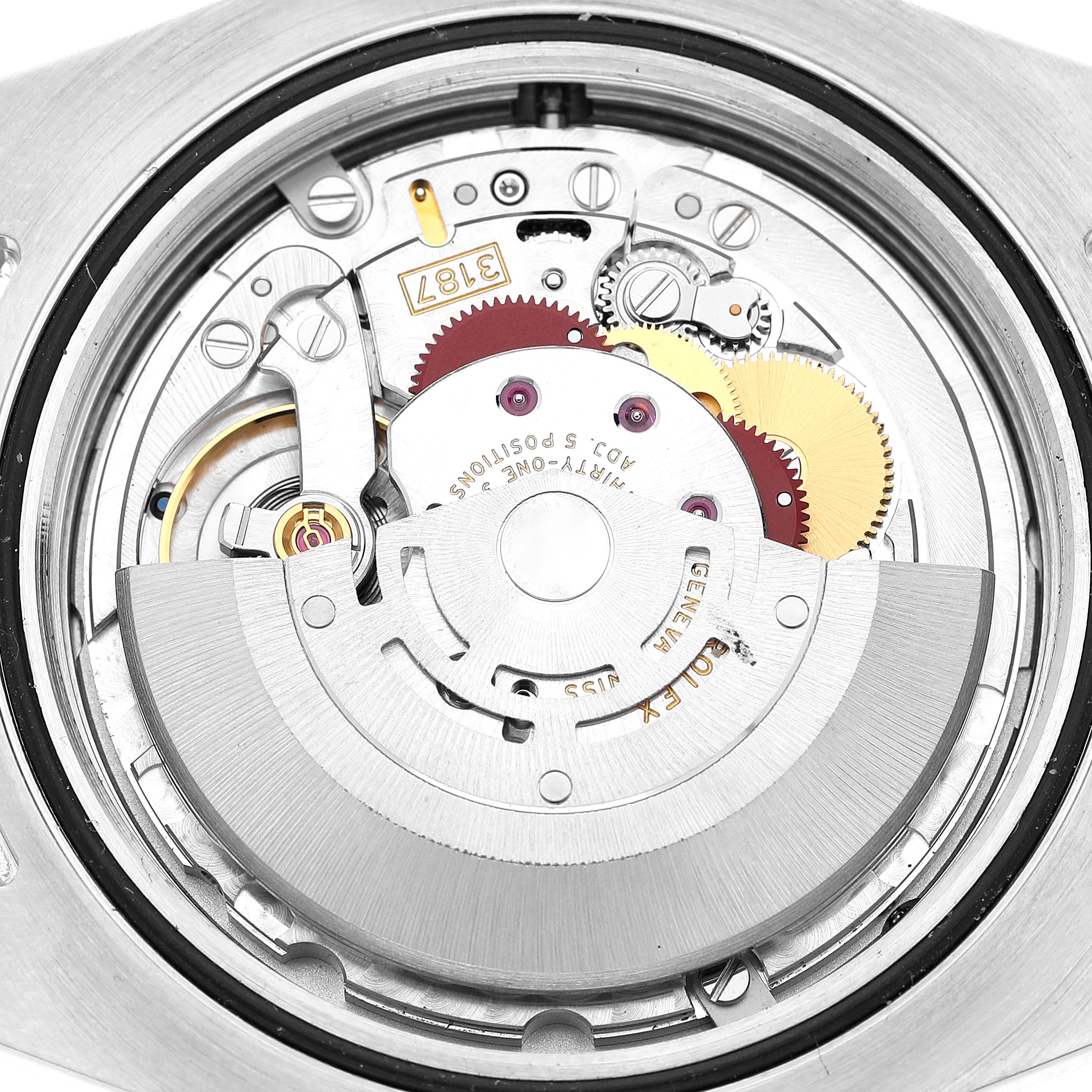 The image shows a top-down view of the Rolex Explorer 216570 Men's Stainless Steel White Dial's movement, highlighting gears and the rotor.