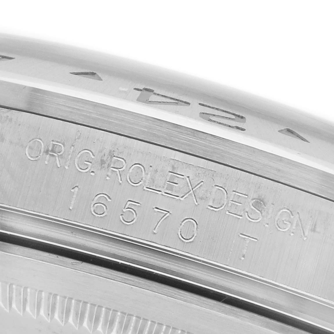 The image shows a close-up of the side of a Rolex Explorer 16570 Men's Stainless Steel White Dial 16570 Men's Stainless Steel White Dial, highlighting its engraved model details.