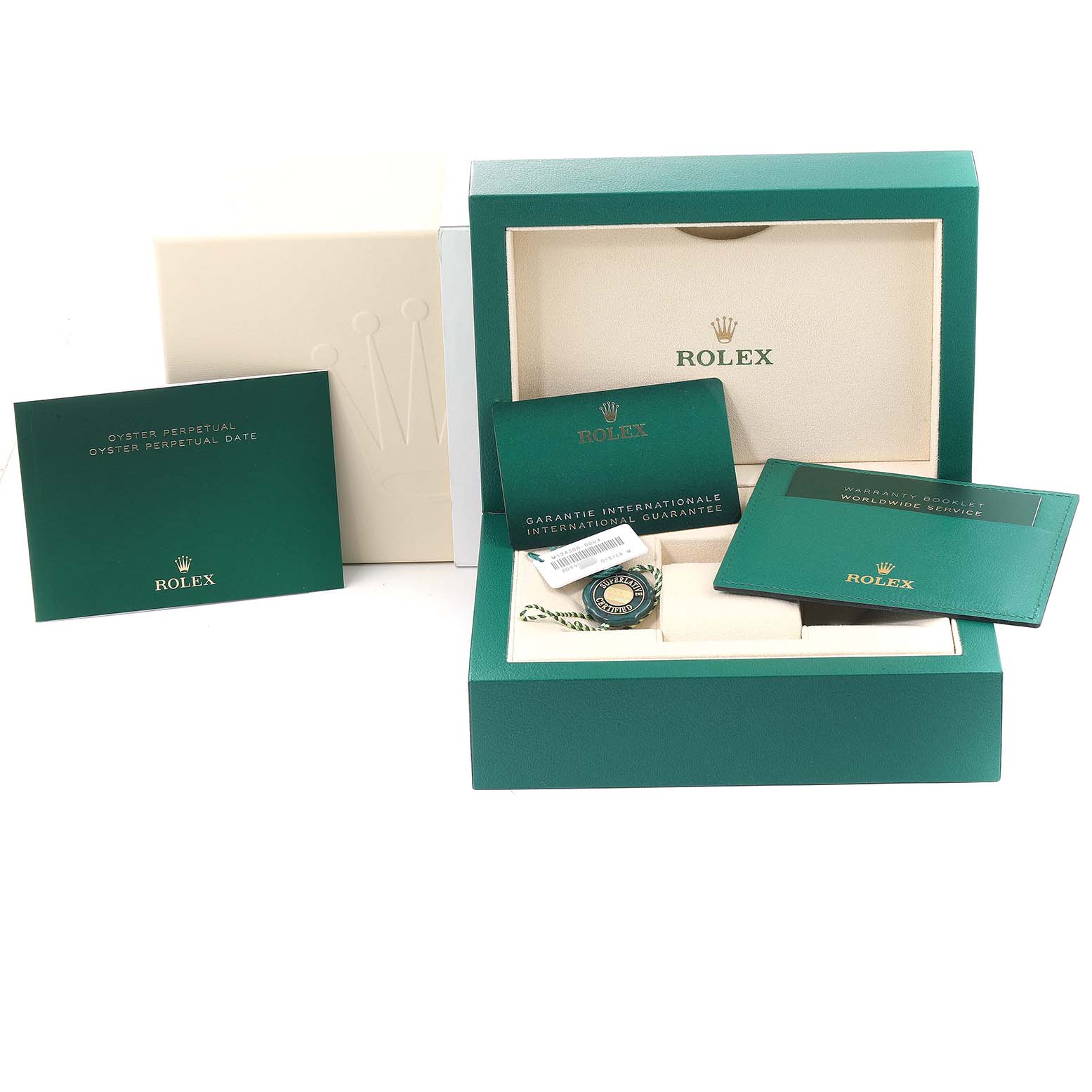The image shows the packaging and accessories of a Rolex Oyster Perpetual 124300 Men's Stainless Steel Yellow Dial 124300 Men's Stainless Steel Yellow Dial watch, including international guarantees and booklets.