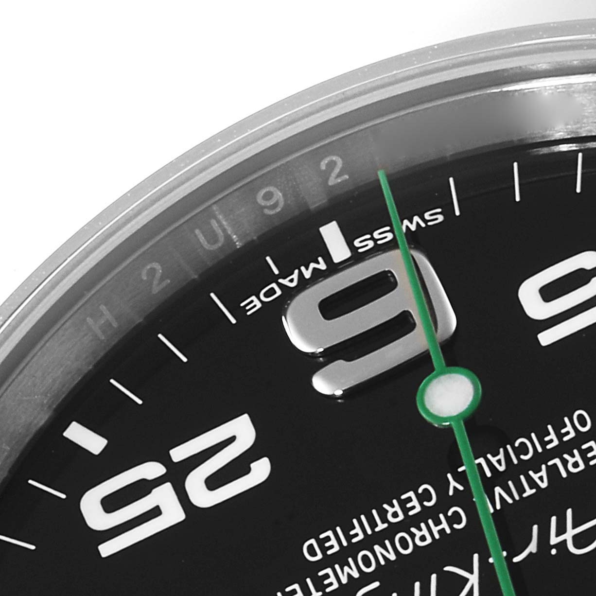 This close-up image of a Rolex Air-King 116900 Men's Stainless Steel Black Dial 116900 Men's Stainless Steel Black Dial watch shows part of the black dial, the "9" numeral, green second hand, and "Swiss Made" text.