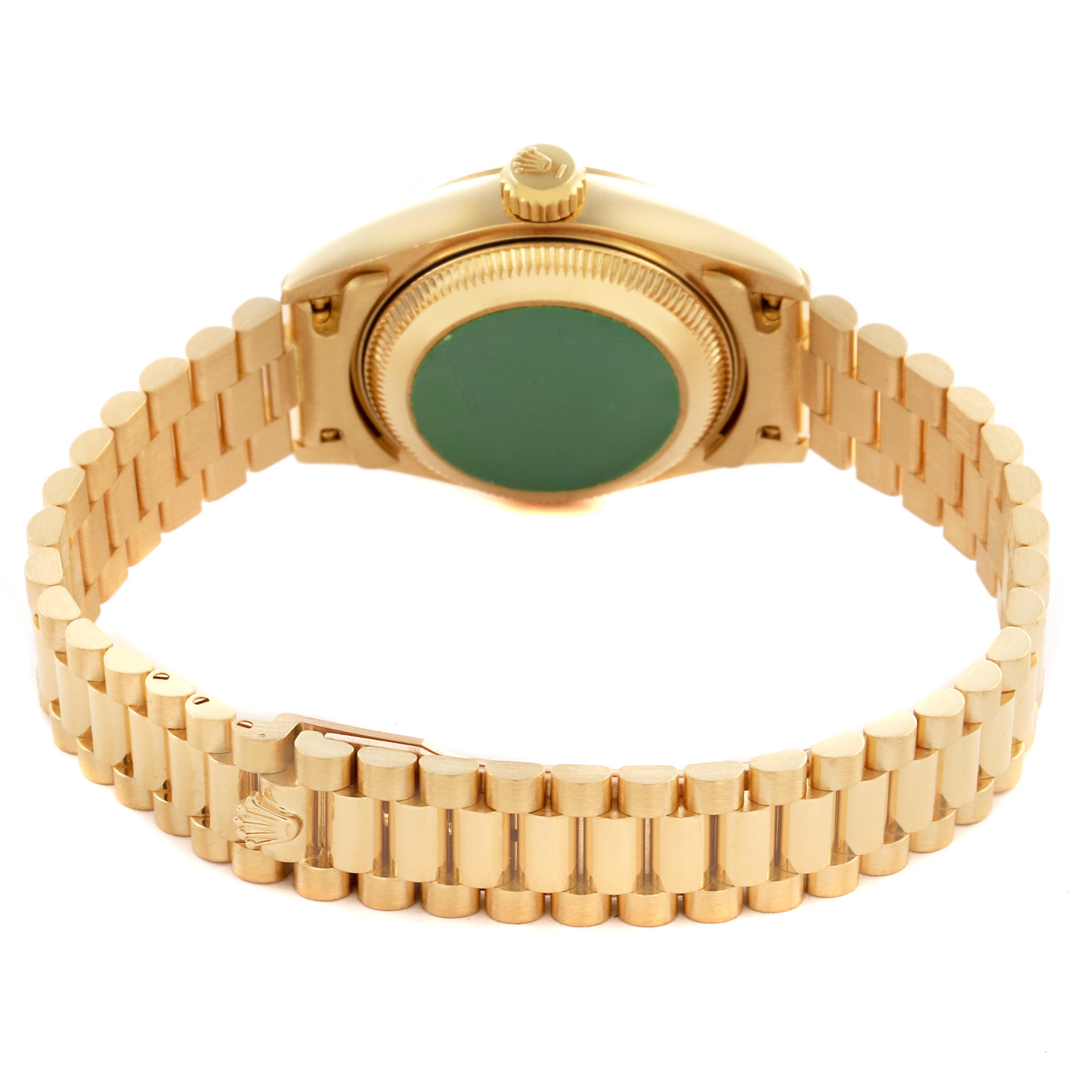 The Rolex President 69178 Women
s Yellow Gold Black Dial 69178 Women
s Yellow Gold Black Dial model is shown from the back, highlighting the case back, bracelet, and clasp.