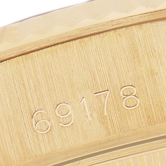 The image shows a close-up of the engraved model number on the gold case side of a Rolex President 69178 Women
s Yellow Gold Black Dial 69178 Women
s Yellow Gold Black Dial watch.