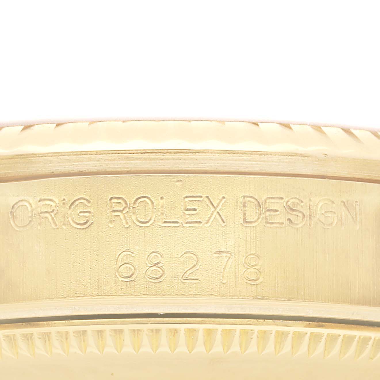 Close-up view of the case side showing the serial number and "ORIG ROLEX DESIGN" on the Rolex President 68278 Women
s Yellow Gold Champagne Dial 68278 Women
s Yellow Gold Champagne Dial model.