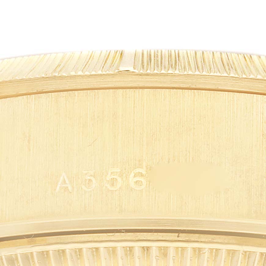 This image shows a close-up of the side bezel and engraved serial number of a Rolex President 79278 Women's Yellow Gold Champagne Dial 79278 Women's Yellow Gold Champagne Dial model watch.