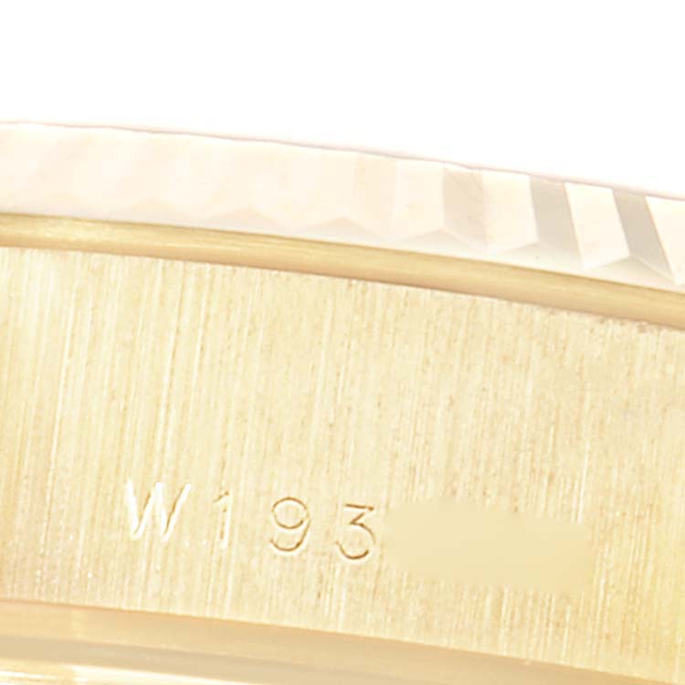 The image shows a close-up of the fluted bezel and part of the case side with engraved numbers on a Rolex President 69178 Women
s Yellow Gold Champagne Dial 69178 Women
s Yellow Gold Champagne Dial model watch.