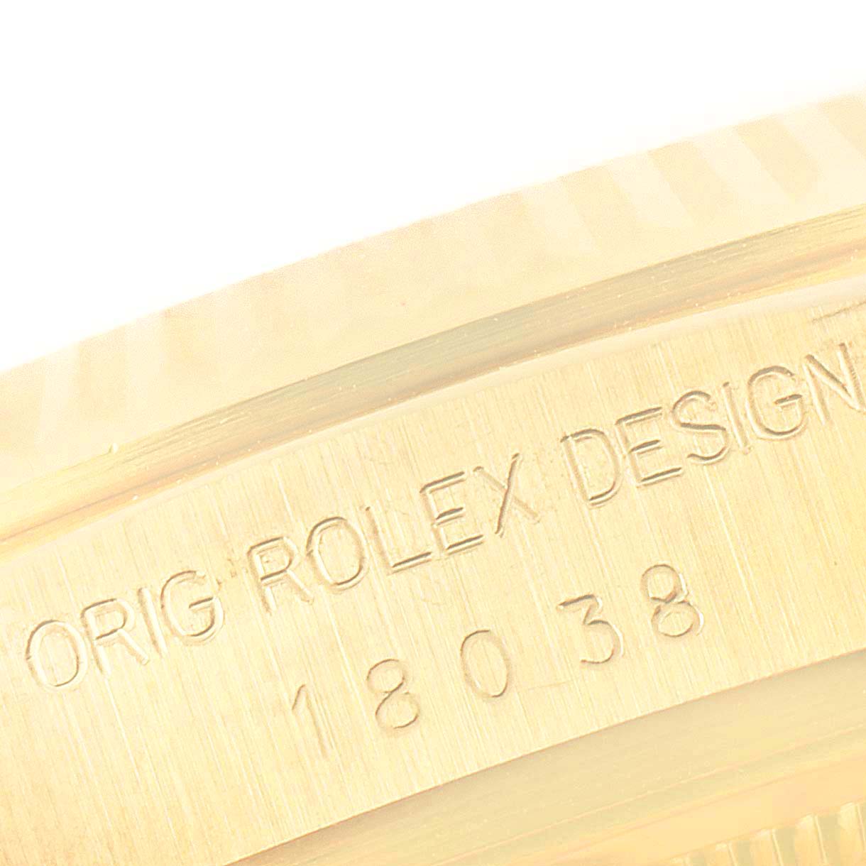 This close-up image shows the engraved serial and model numbers on the case edge of a Rolex President 18038 Men
s Yellow Gold Champagne Dial 18038 Men
s Yellow Gold Champagne Dial.