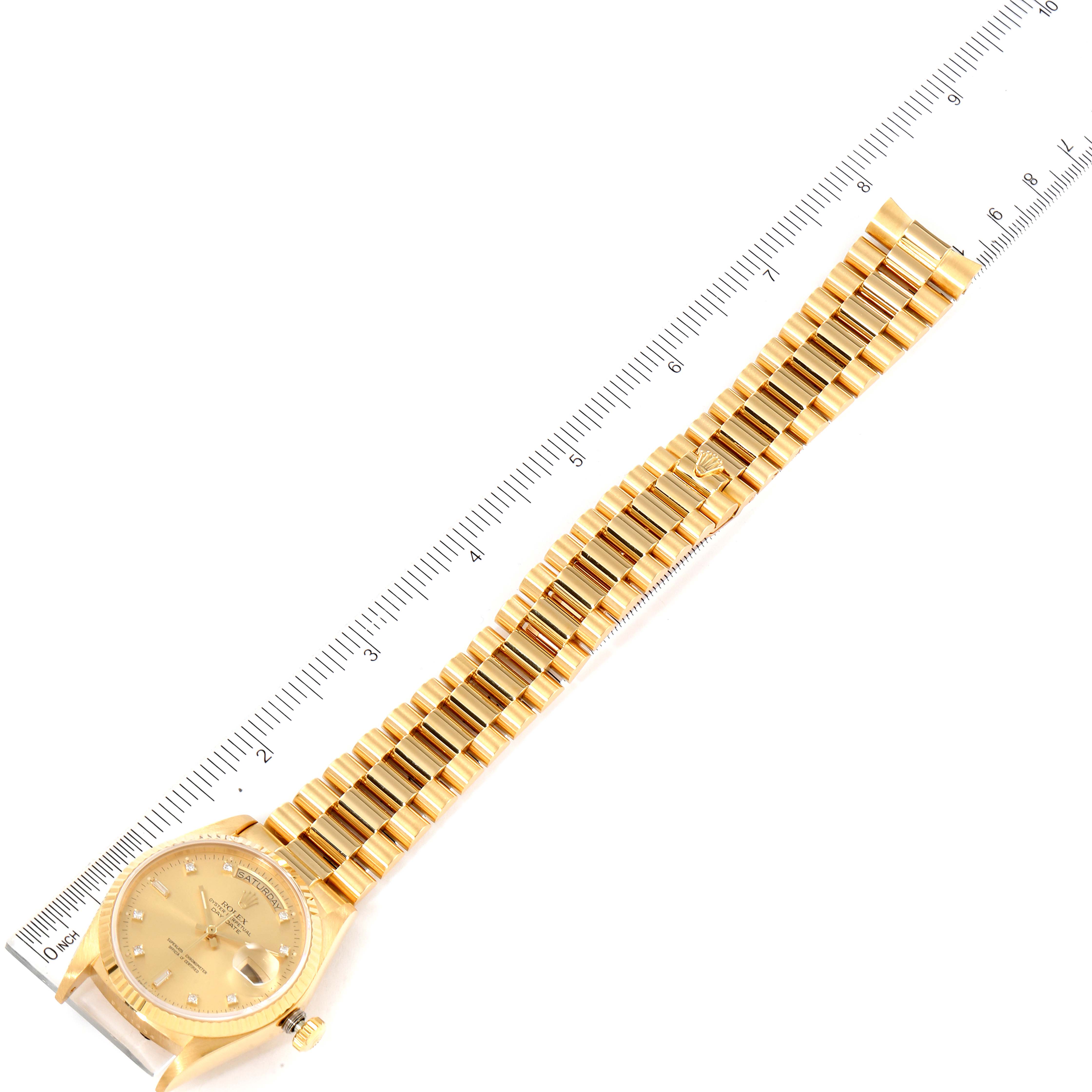 The image shows a Rolex President 18038 Men
s Yellow Gold Champagne Dial 18038 Men
s Yellow Gold Champagne Dial model watch laid flat with a ruler for measurement.