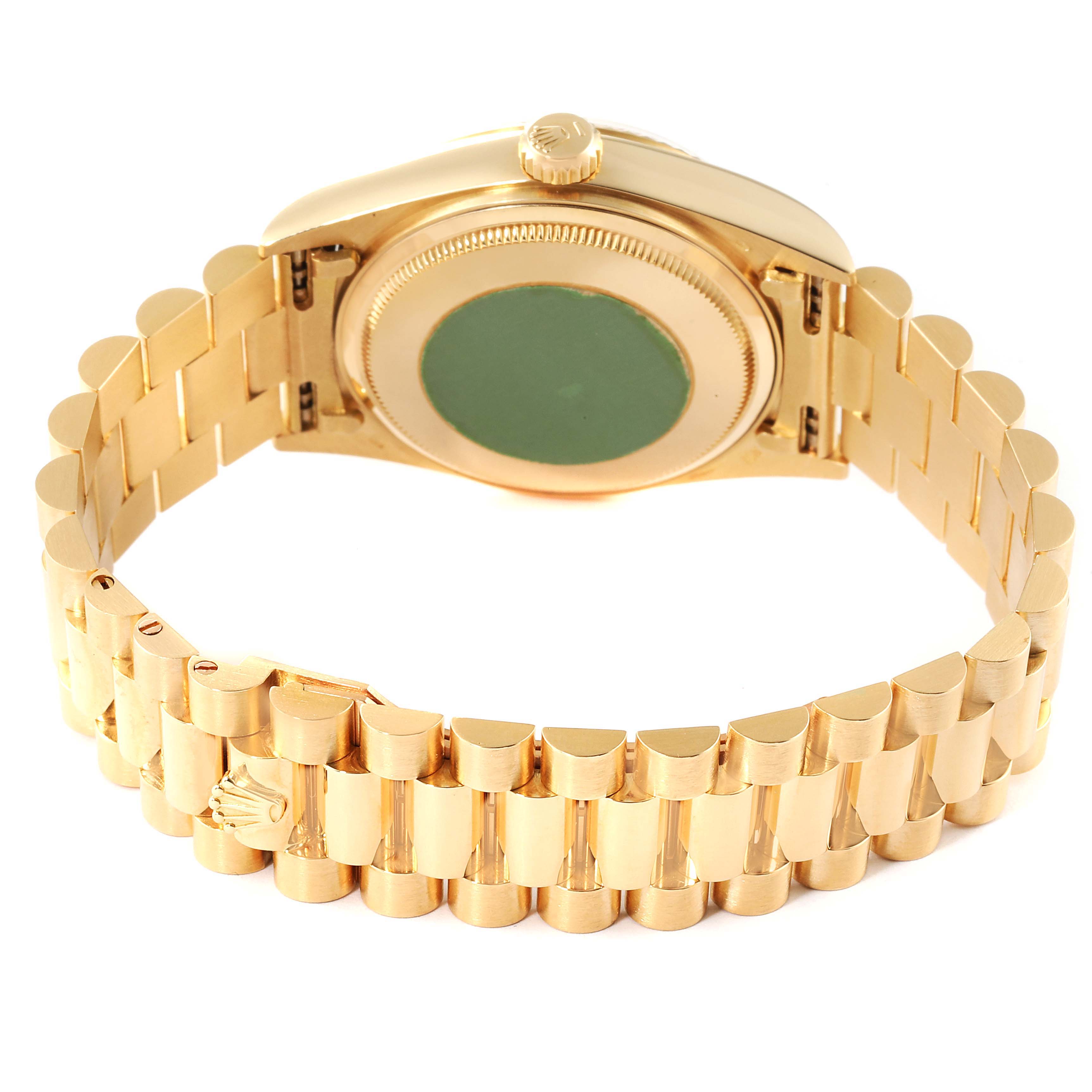 This image shows the back and bracelet of a Rolex President 18038 Men
s Yellow Gold Champagne Dial 18038 Men
s Yellow Gold Champagne Dial model watch, viewed at an angle displaying the case back and side profile.