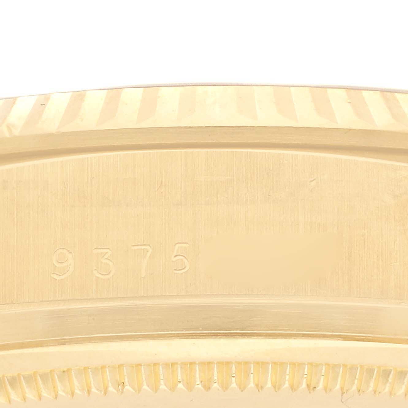 The image shows a close-up of the side of a Rolex President 18038 Men's Yellow Gold Champagne Dial 18038 Men's Yellow Gold Champagne Dial watch, focusing on the edge with visible engravings.