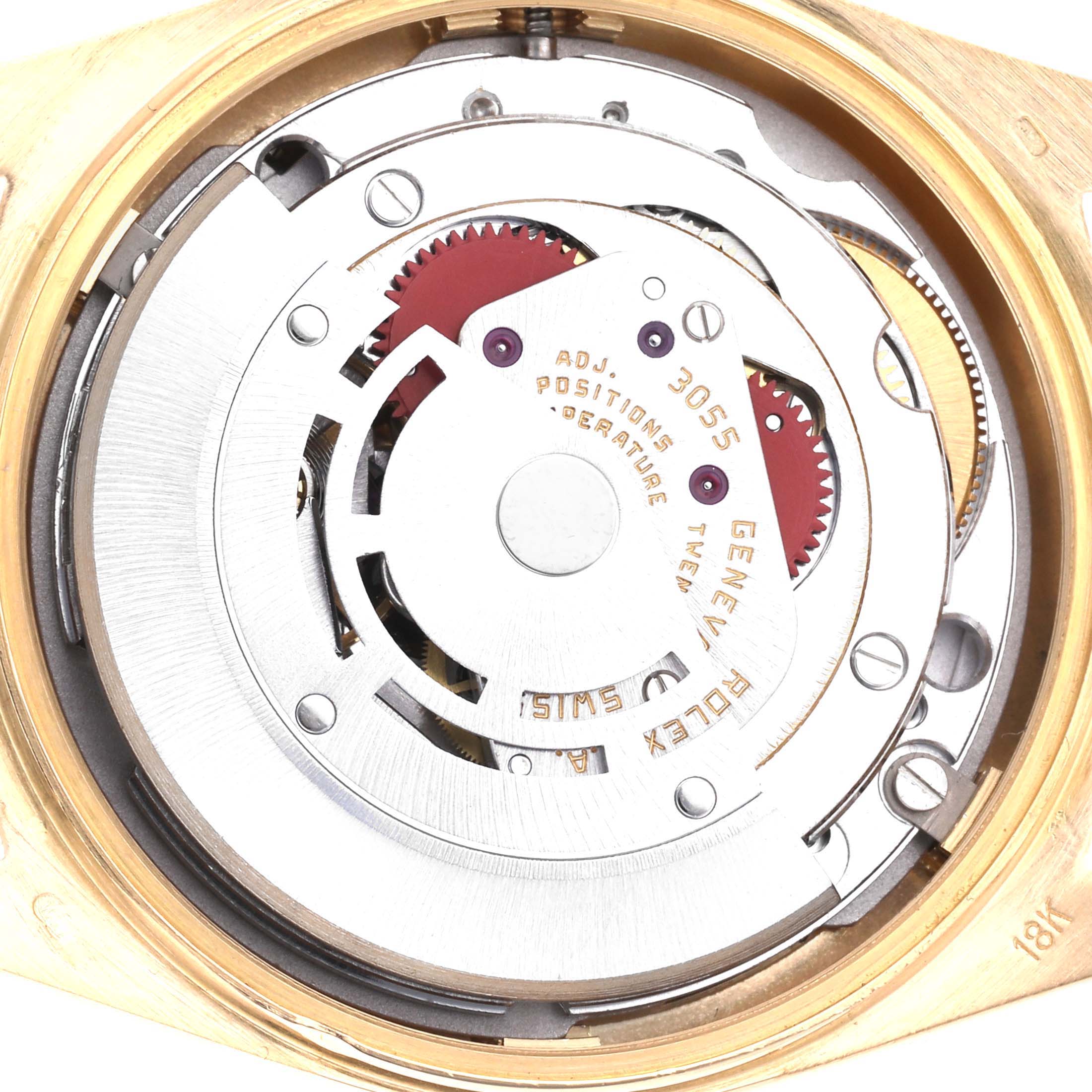 The image shows the movement of a Rolex President 18038 Men's Yellow Gold Champagne Dial 18038 Men's Yellow Gold Champagne Dial model watch viewed from the back, highlighting gears and engravings.