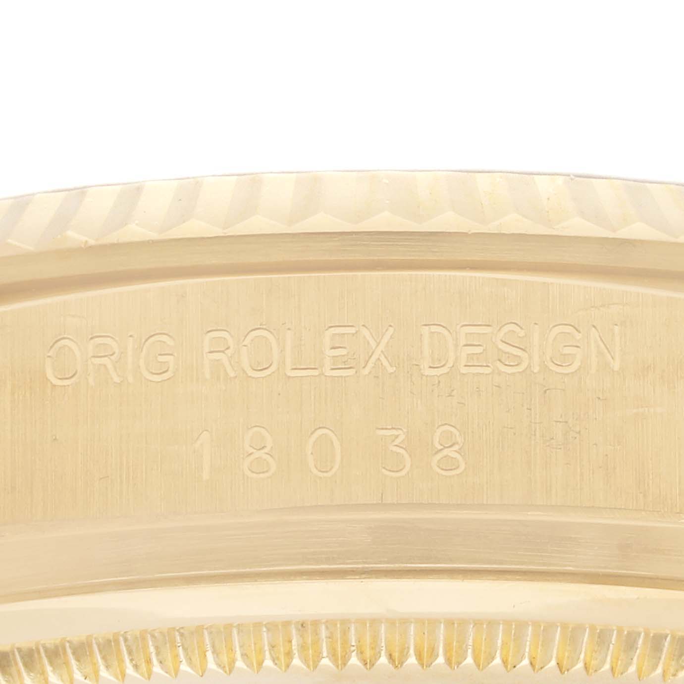 The image shows a close-up of the side of a Rolex President 18038 Men's Yellow Gold Champagne Dial 18038 Men's Yellow Gold Champagne Dial model, highlighting the engraved design and model number.