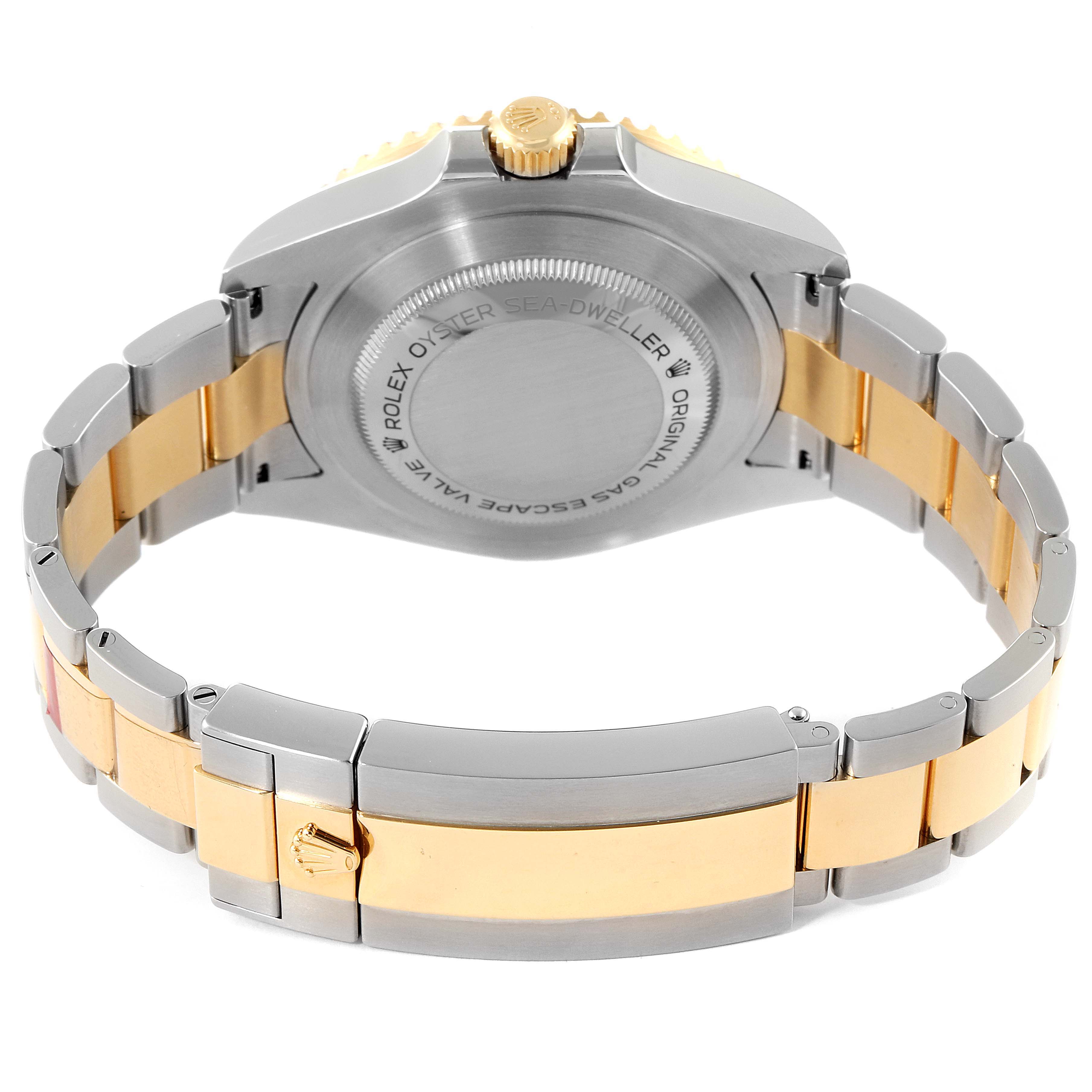 The image shows the back case and bracelet of a Rolex Sea-Dweller 126603 Men
s Steel and Gold (two tone) Black Dial 126603 Men
s Steel and Gold (two tone) Black Dial watch.