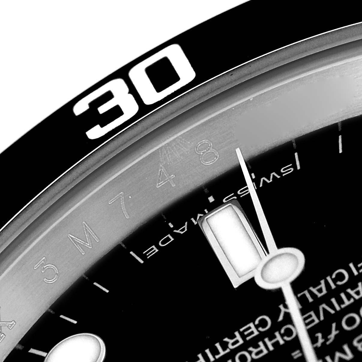 The image shows a close-up of the bezel and dial of a Rolex Submariner 14060M Men
s Stainless Steel Black Dial 14060M Men
s Stainless Steel Black Dial, highlighting the 30 mark and part of the minute hand.