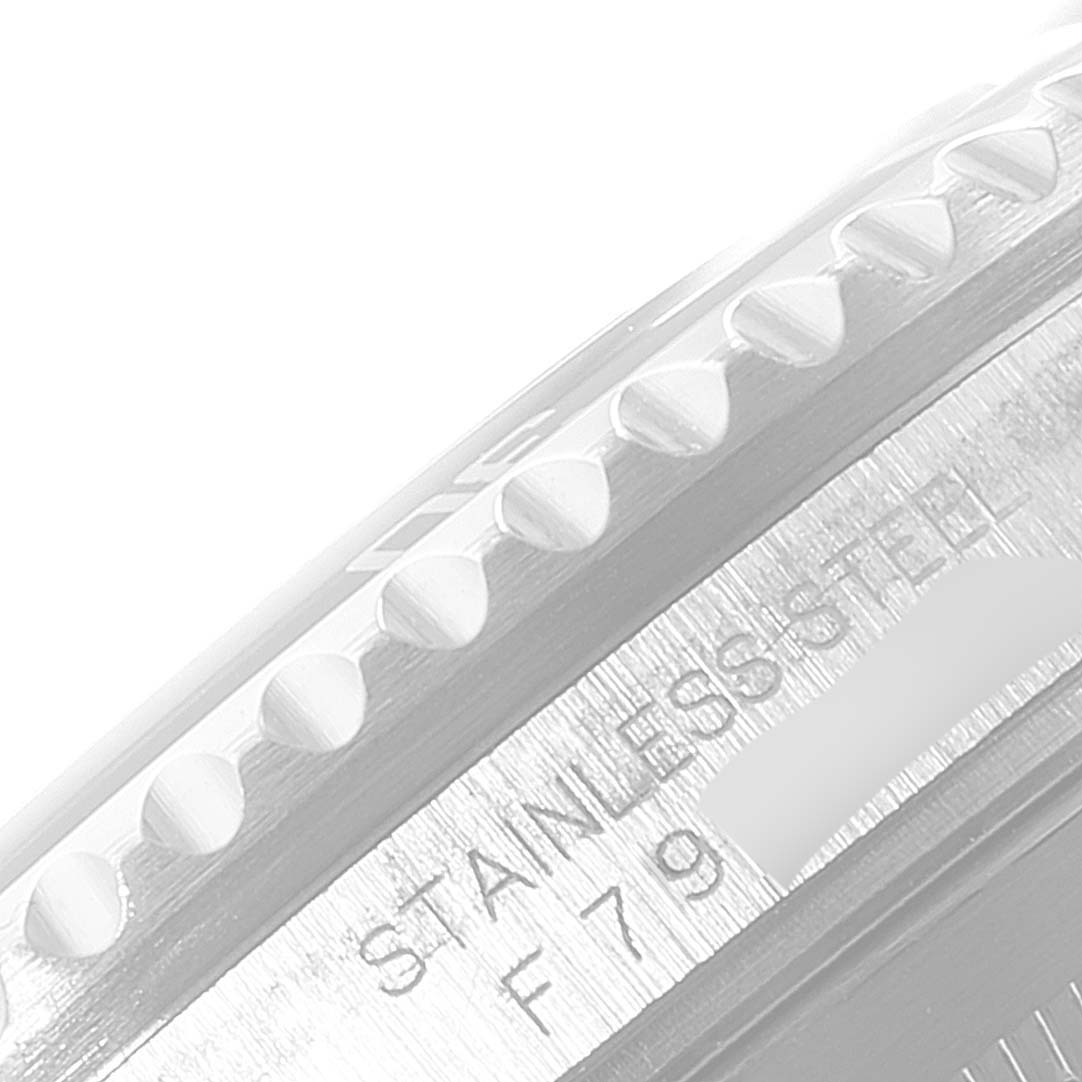 This image shows a close-up of the bezel and the case side, revealing the stainless steel material and partial model number of the Rolex Submariner 16610 Men
s Stainless Steel Black Dial 16610 Men
s Stainless Steel Black Dial.