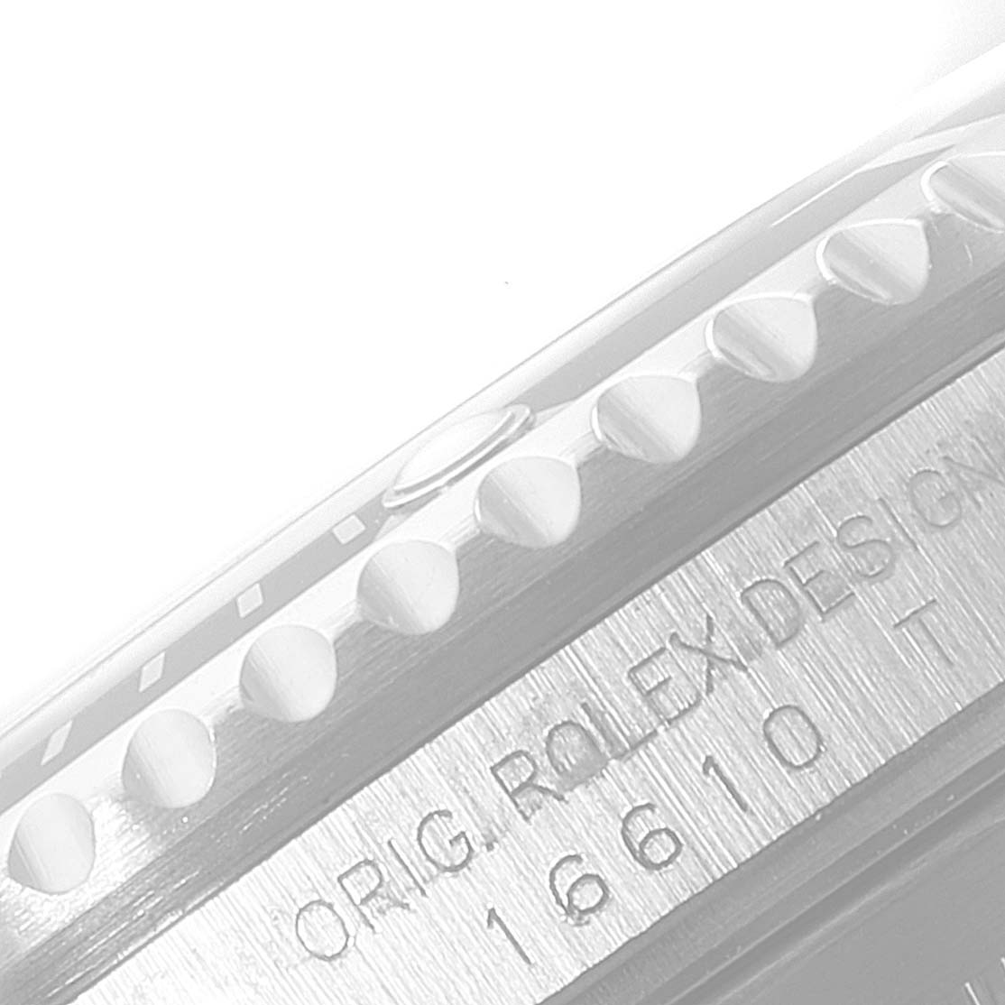 This close-up image shows the bezel and engraved case side of a Rolex Submariner 16610 Men
s Stainless Steel Black Dial 16610 Men
s Stainless Steel Black Dial watch.