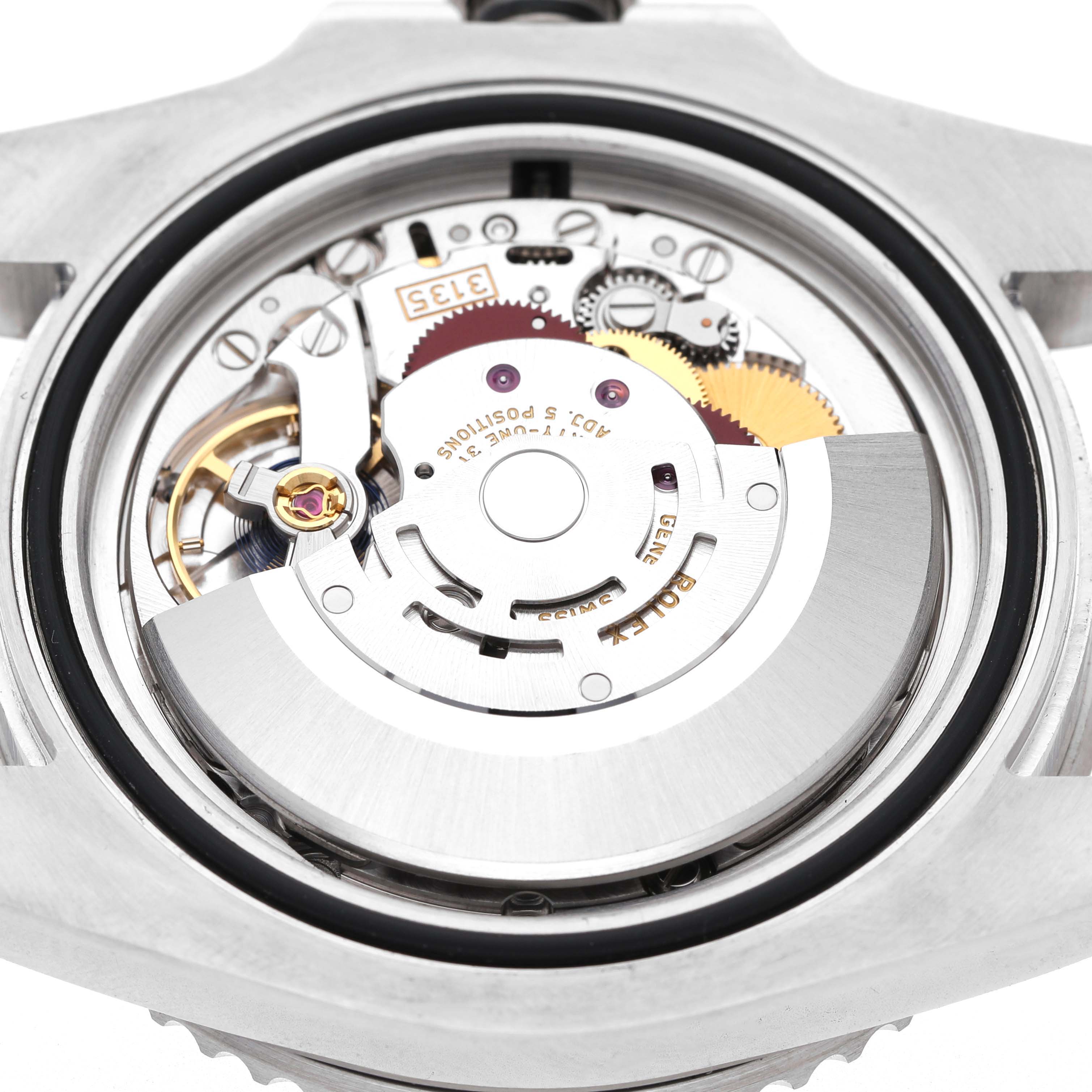 The image shows the movement and internal mechanism of a Rolex Submariner 116610LN Men's Stainless Steel Black Dial, viewed from the backside.