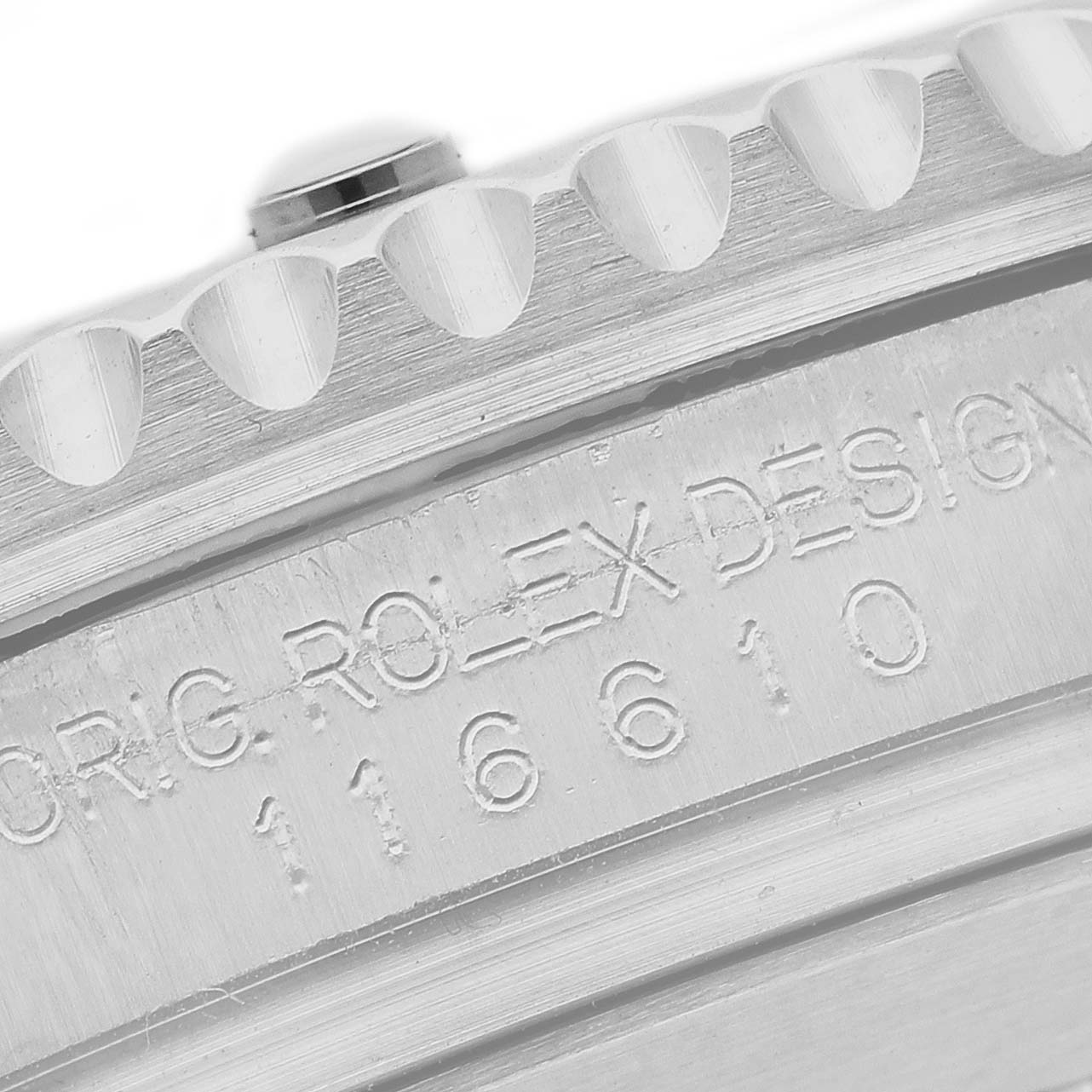 The image shows a close-up of the bezel and engraved model number "116610" on a Rolex Submariner 116610LN Men's Stainless Steel Black Dial.