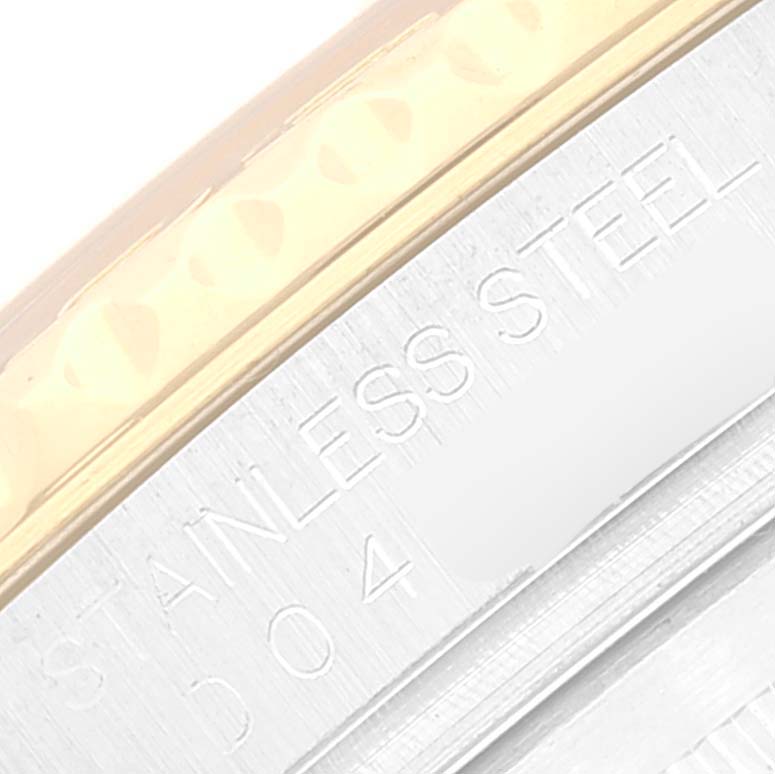 The image shows a close-up of the edge of the bezel and the engraving on the caseback of a Rolex Yacht-Master 16623 Men
s Steel and Gold (two tone) White Dial 16623 Men
s Steel and Gold (two tone) White Dial watch.
