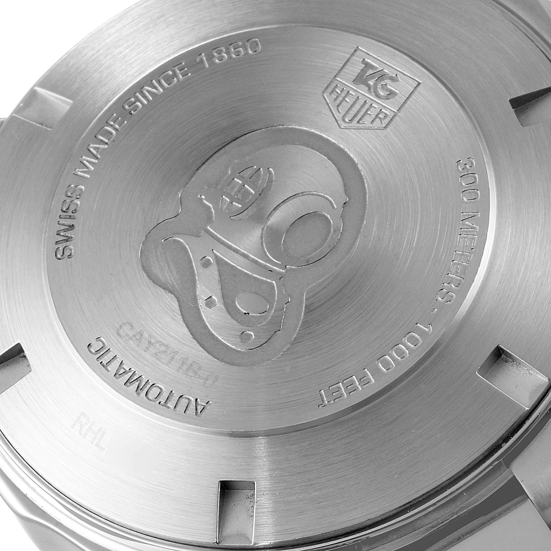 The image shows a close-up of the case back of a Tag Heuer Aquaracer CAY211B.BA0927 Men's Stainless Steel Blue Dial CAY211B.BA0927 Men's Stainless Steel Blue Dial watch, highlighting the engraved details.