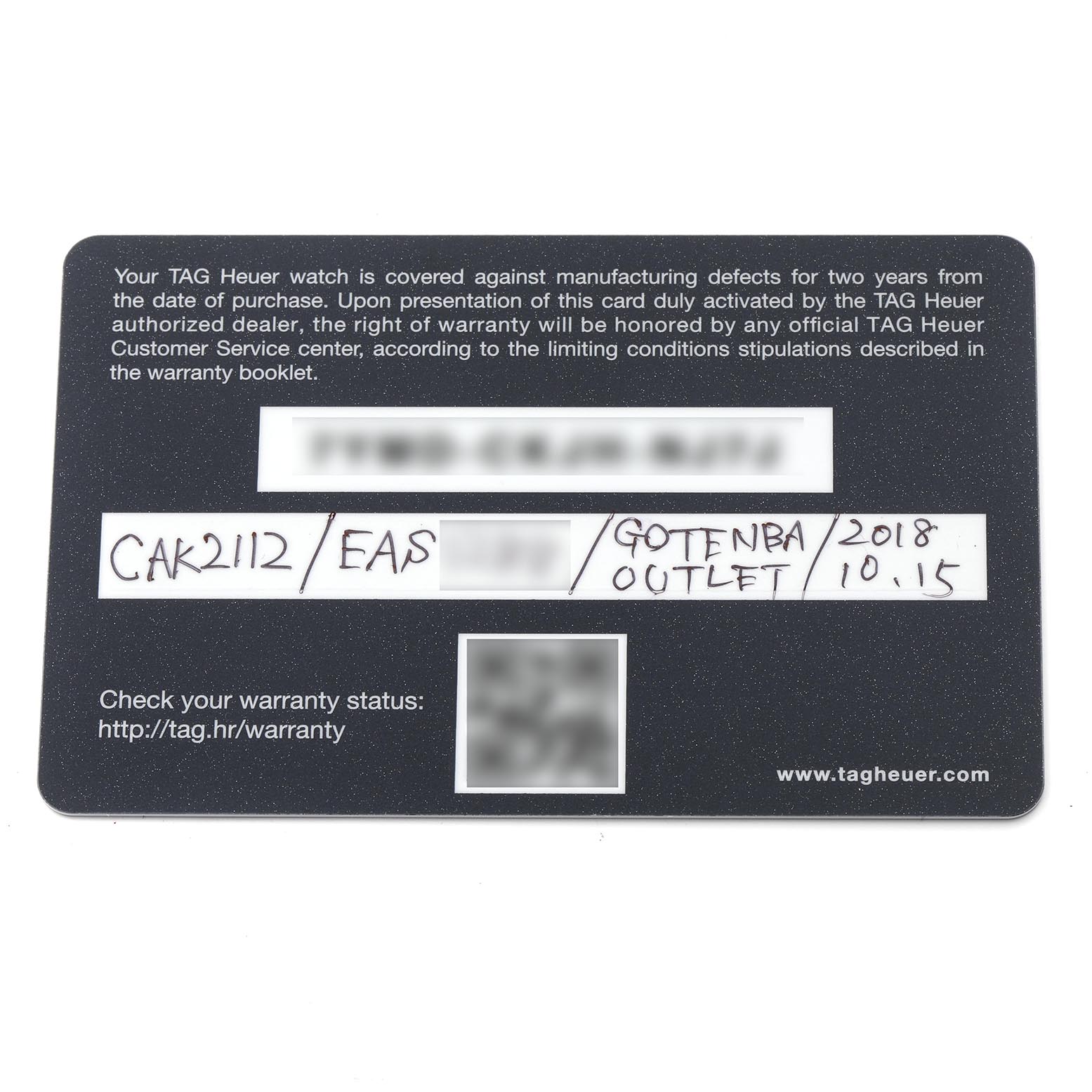 The image shows the warranty card for the Tag Heuer Aquaracer CAK2112.BA0833 Men's Stainless Steel Blue Dial CAK2112.BA0833 Men's Stainless Steel Blue Dial model, viewed from above.