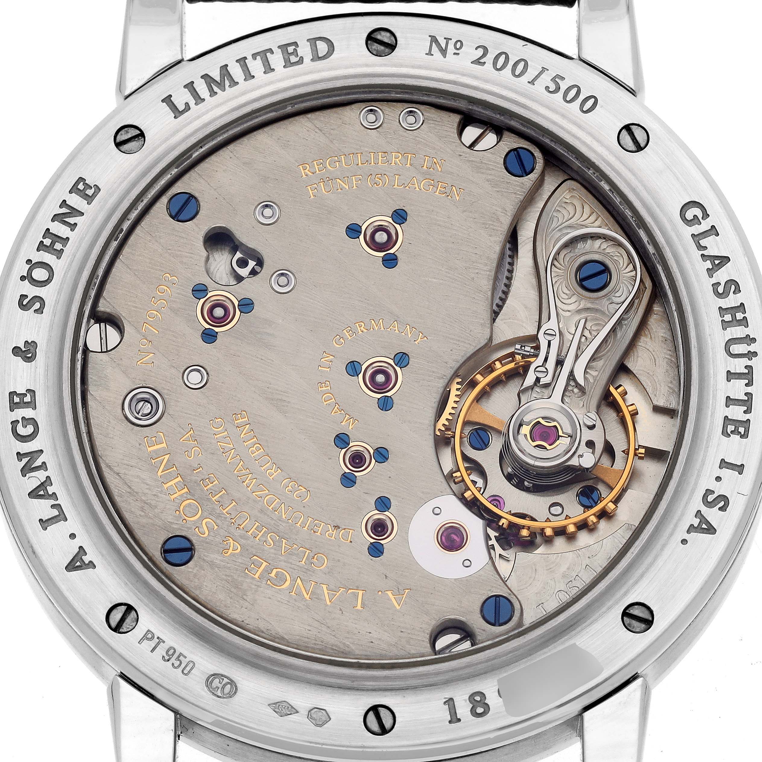The image shows the caseback of an 1815 model by A. Lange & Söhne, revealing the detailed movement and engravings.