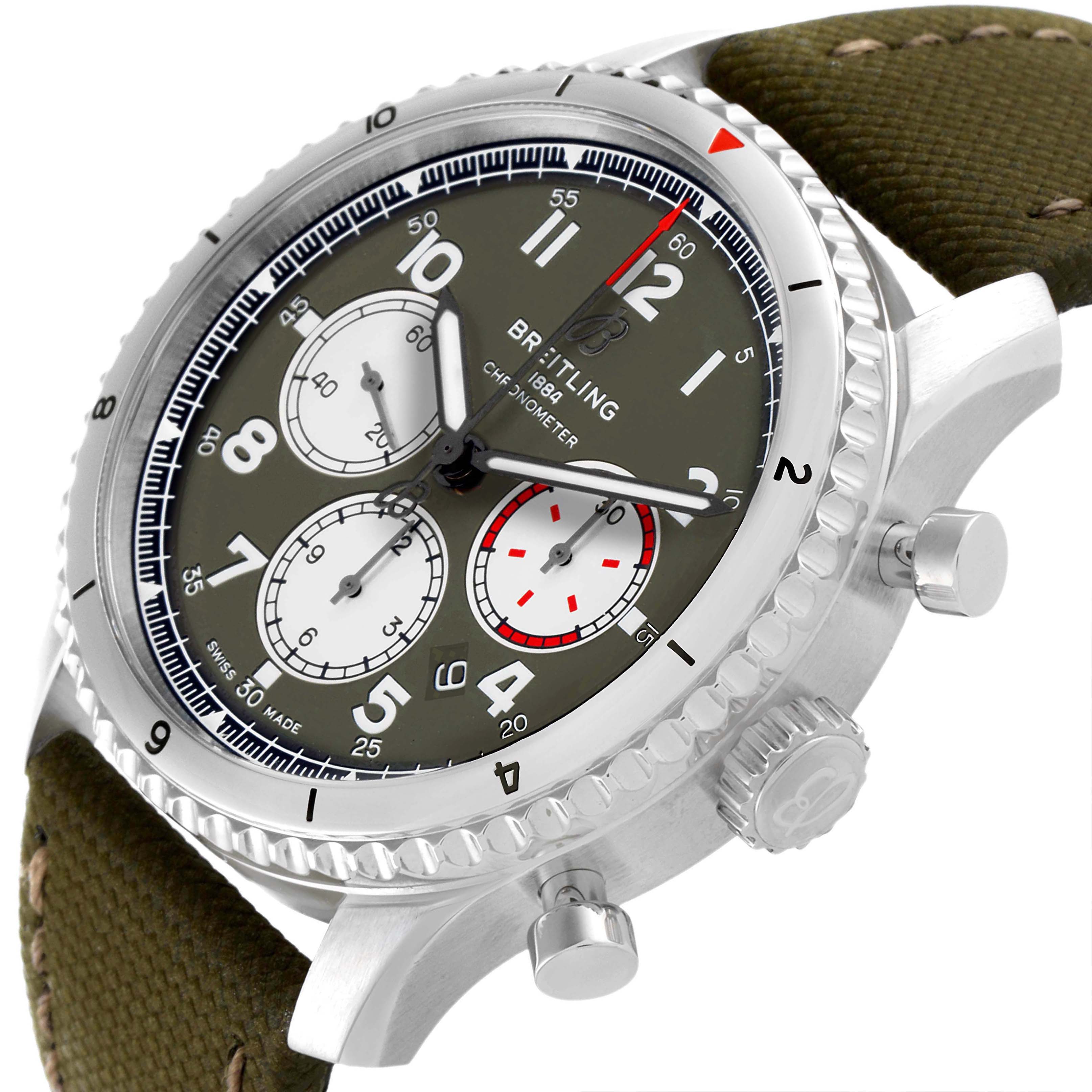 This image shows a close-up angle of the dial, bezel, pushers, and crown of the Breitling Navitimer watch.