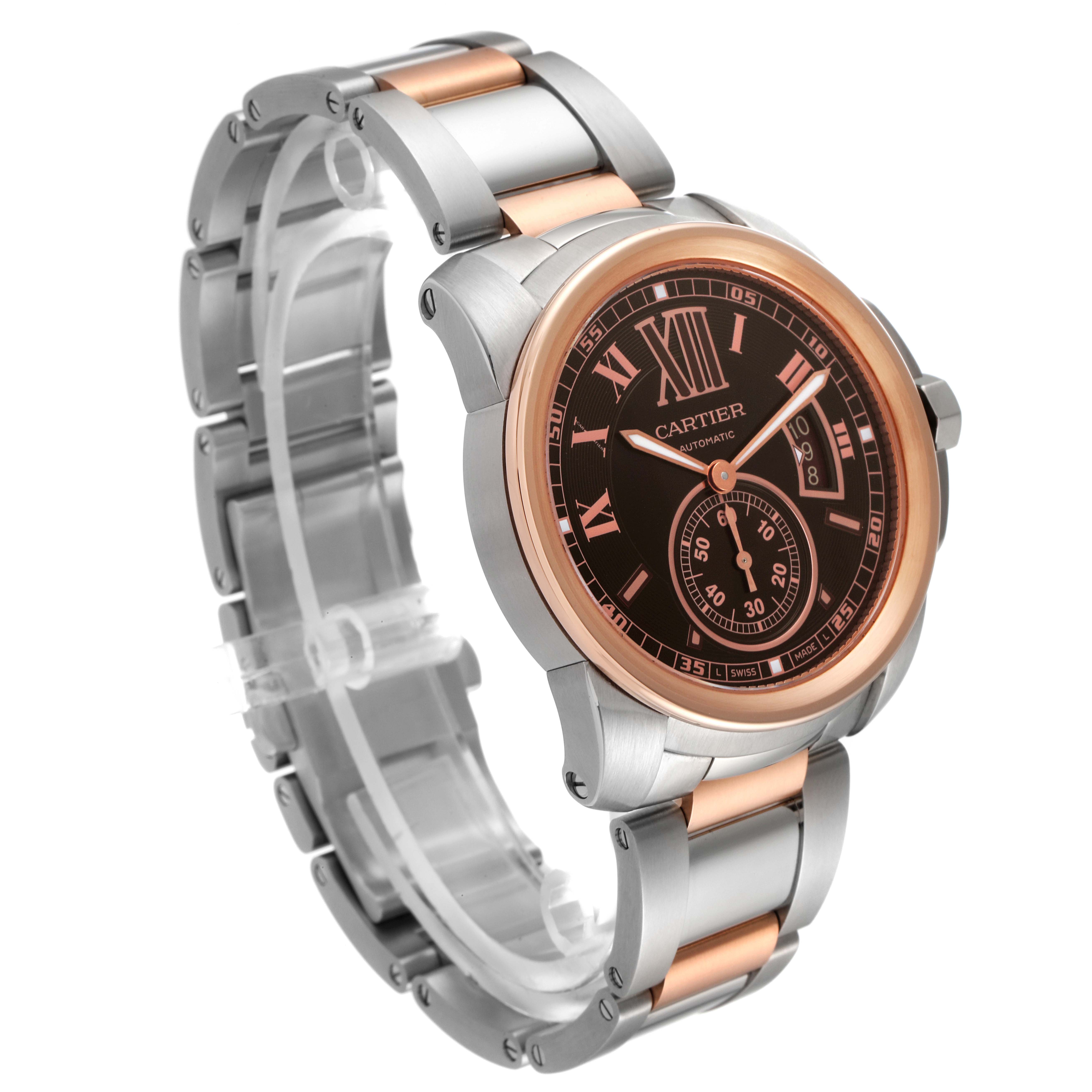 The image shows a Calibre de Cartier watch by Cartier at an angle displaying the face, bezel, and metal strap.