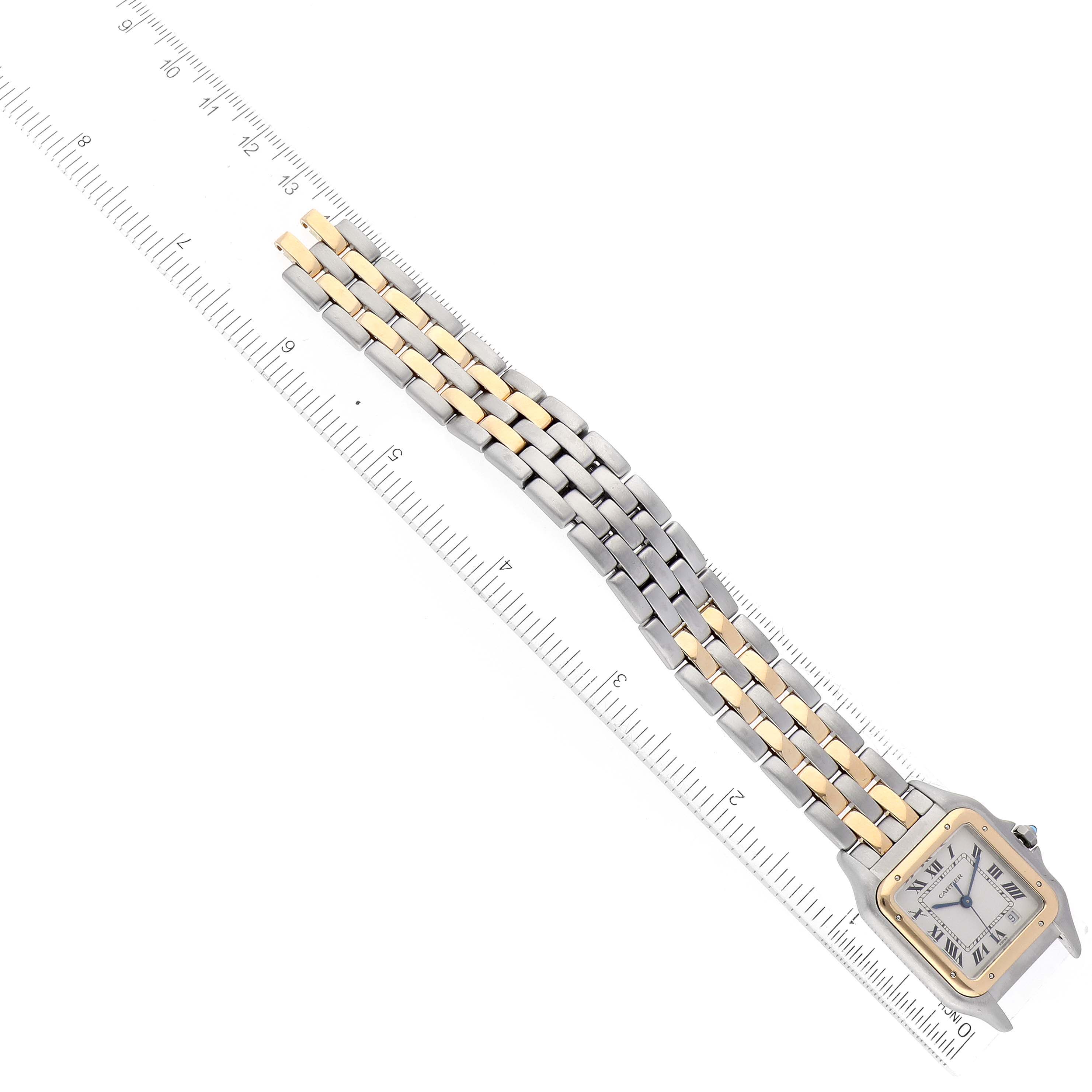 The image shows a Panthere by Cartier watch at an angle, highlighting its face, part of the bracelet, and a ruler.