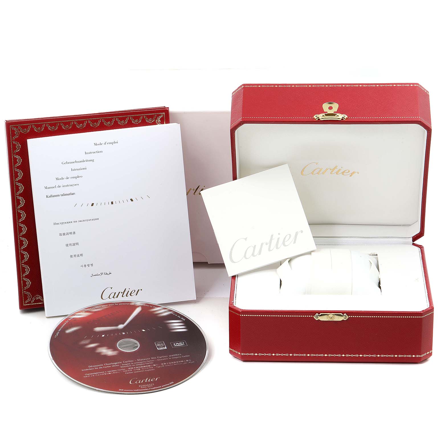 The image shows the packaging and accessories for a Cartier Santos WSSA0018 Men
s Stainless Steel Silver Dial WSSA0018 Men
s Stainless Steel Silver Dial model, including the box, documents, and a CD.