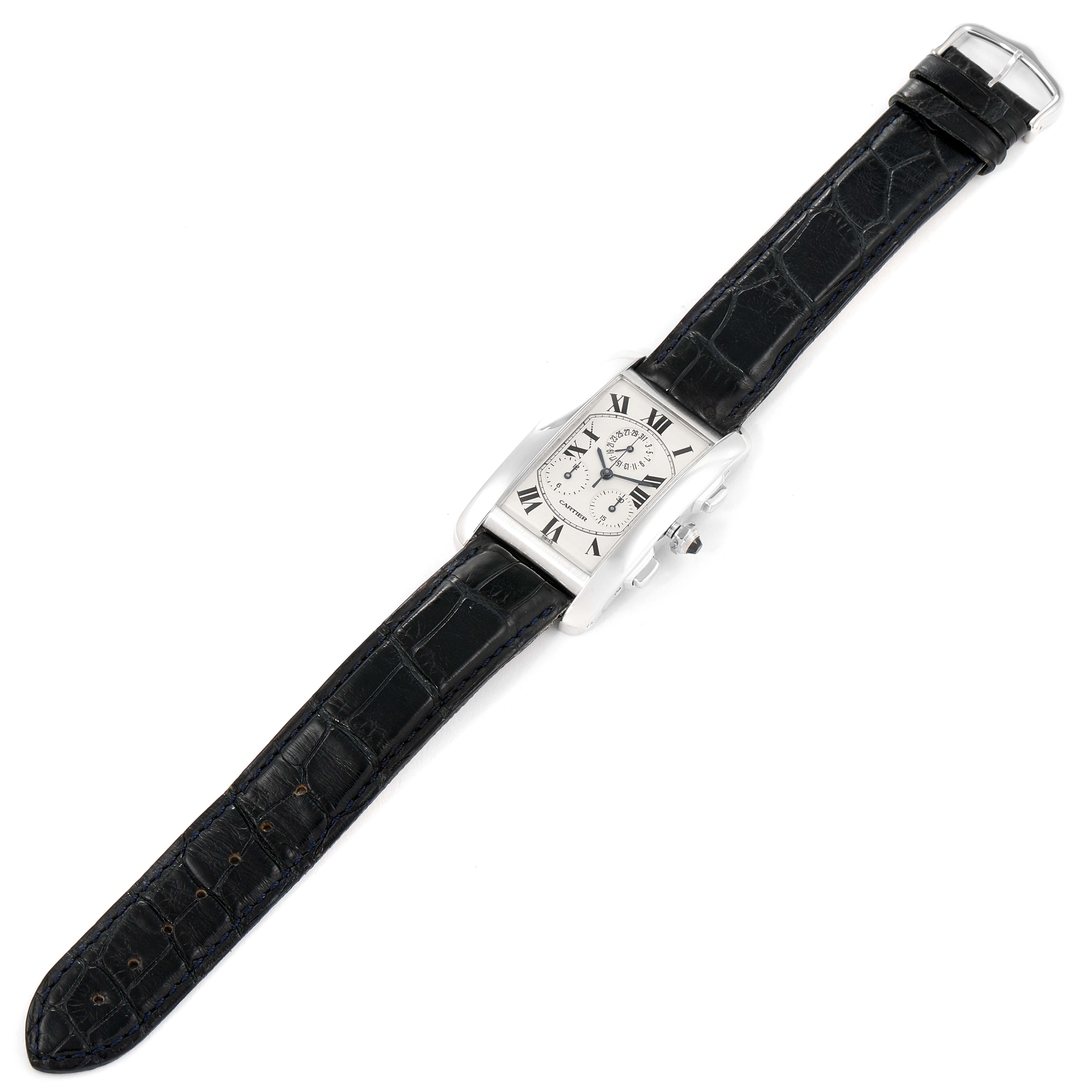 The image shows an overhead view of a Cartier Tank Americaine W2603358 Men's White Gold Silver Dial W2603358 Men's White Gold Silver Dial watch with its black leather strap fully extended.