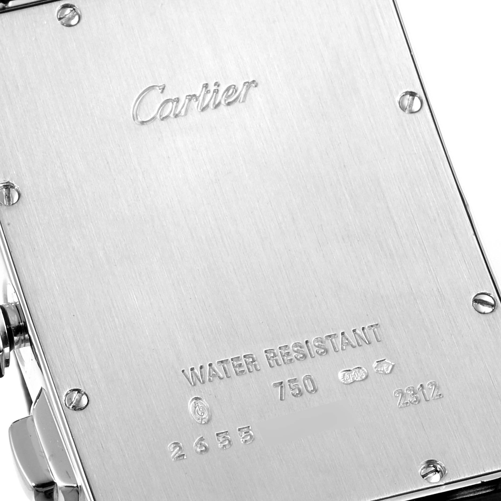 This image shows the back case of a Cartier Tank Americaine W2603358 Men's White Gold Silver Dial W2603358 Men's White Gold Silver Dial watch, highlighting its engravings and screws.