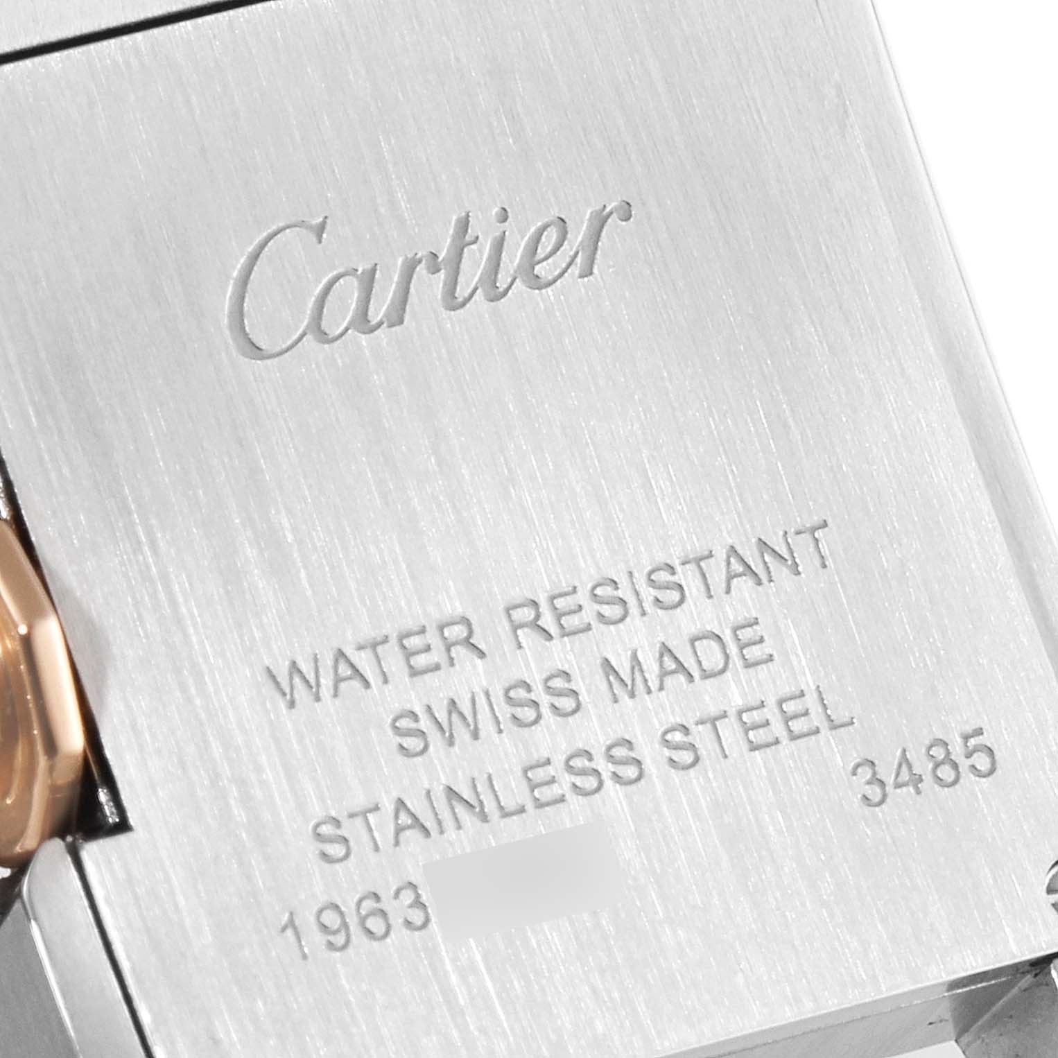 The image shows a close-up of the back casing of a Cartier Tank Anglaise W5310019 Women's Steel and Gold (two tone) Silver Dial W5310019 Women's Steel and Gold (two tone) Silver Dial watch, detailing the engravings.