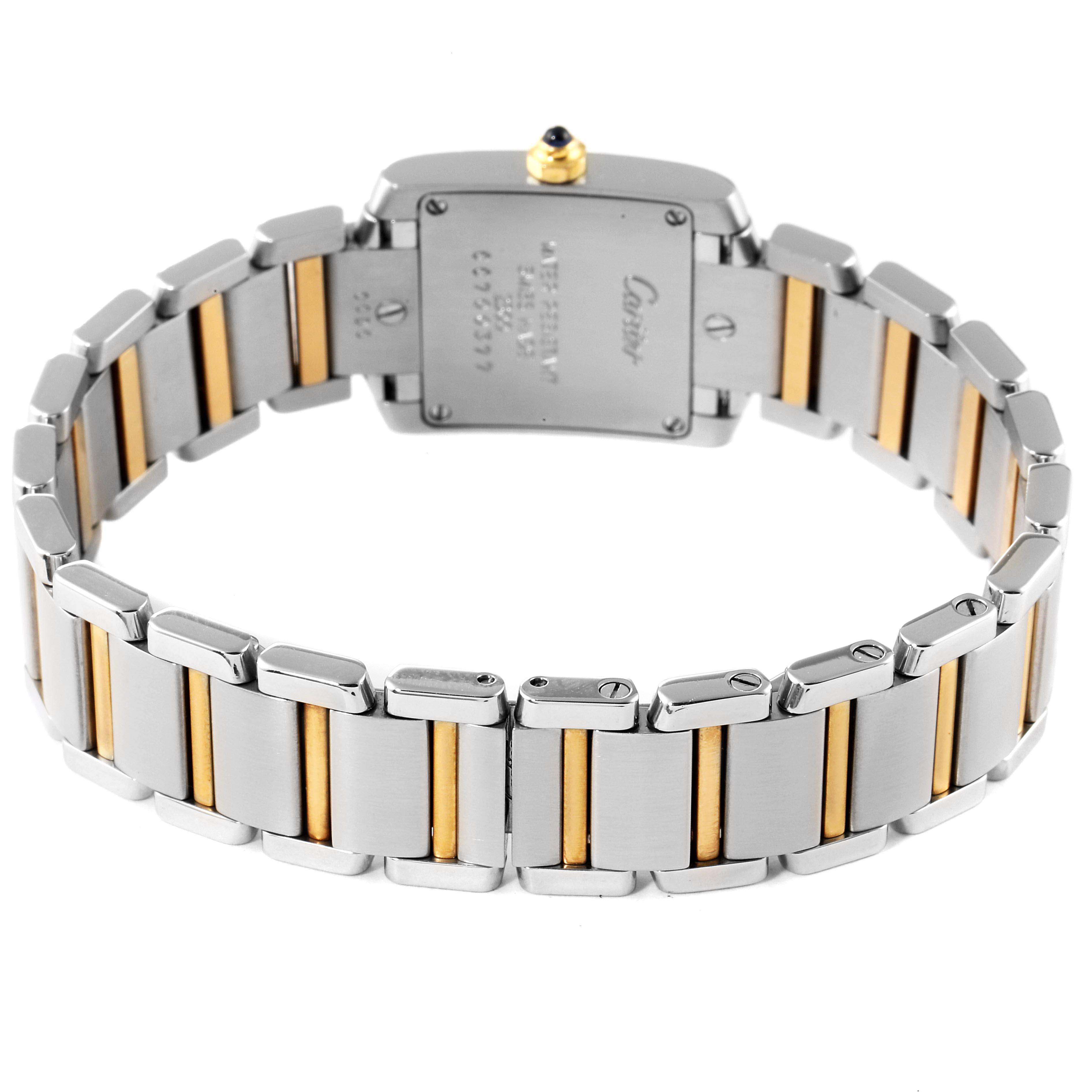 The image shows the rear view of a Cartier Tank Francaise W51007Q4 Women's Steel and Gold (two tone) Silver Dial W51007Q4 Women's Steel and Gold (two tone) Silver Dial watch, highlighting the two-tone bracelet and case back.