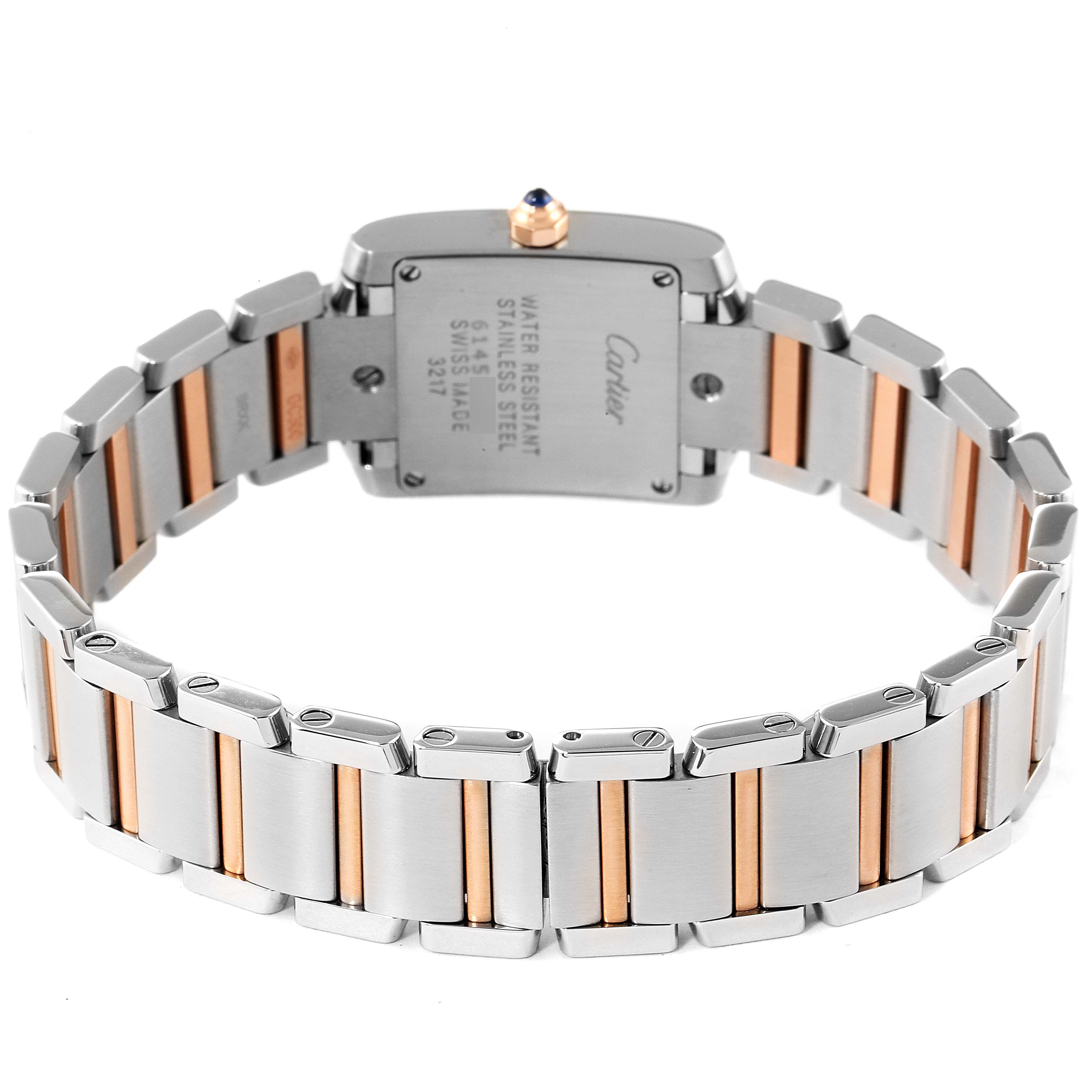 This image shows the back and bracelet of a Cartier Tank Française watch, highlighting the stainless steel and gold accents.