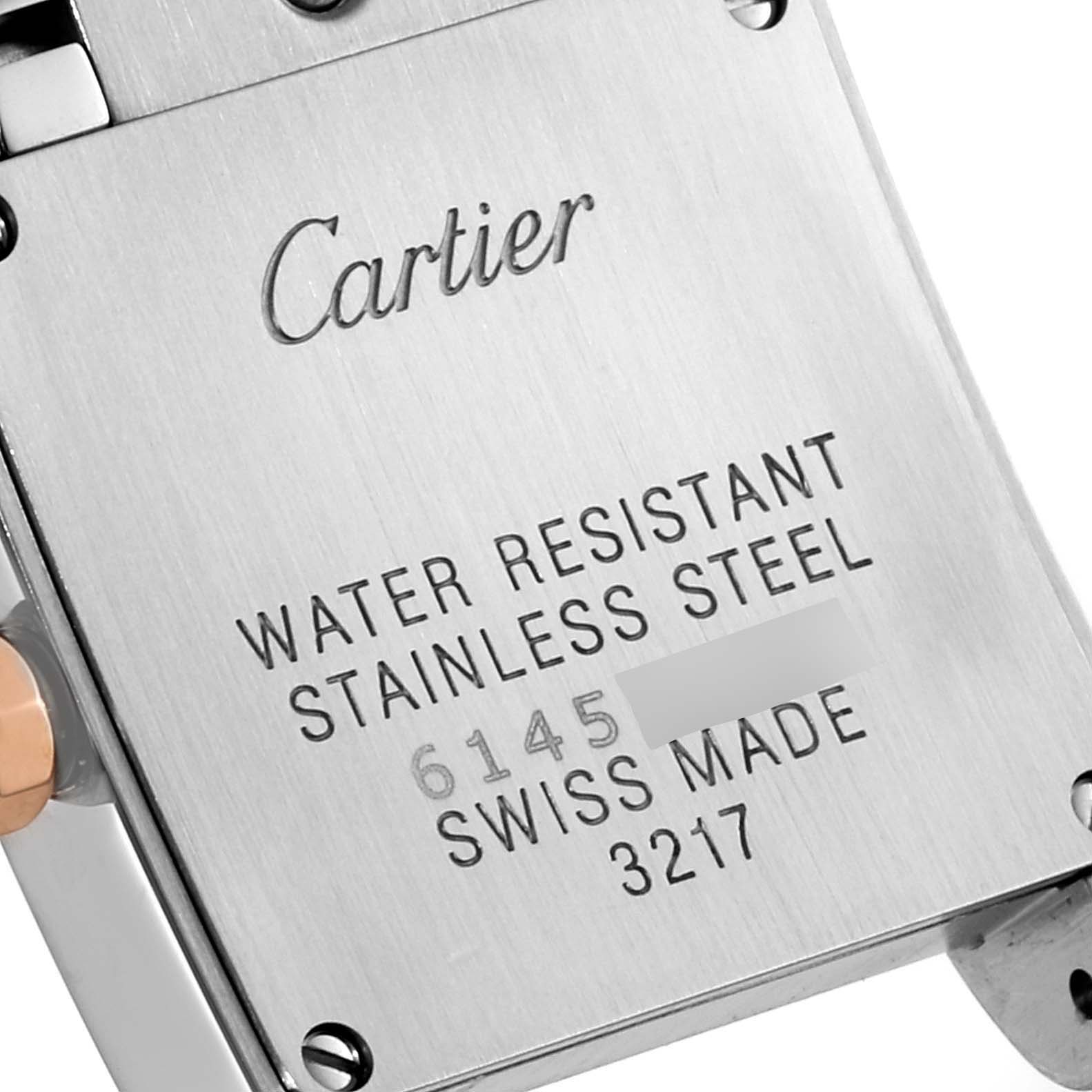 This image shows the back case of the Tank Francaise model by Cartier, featuring engraved details about the watch.