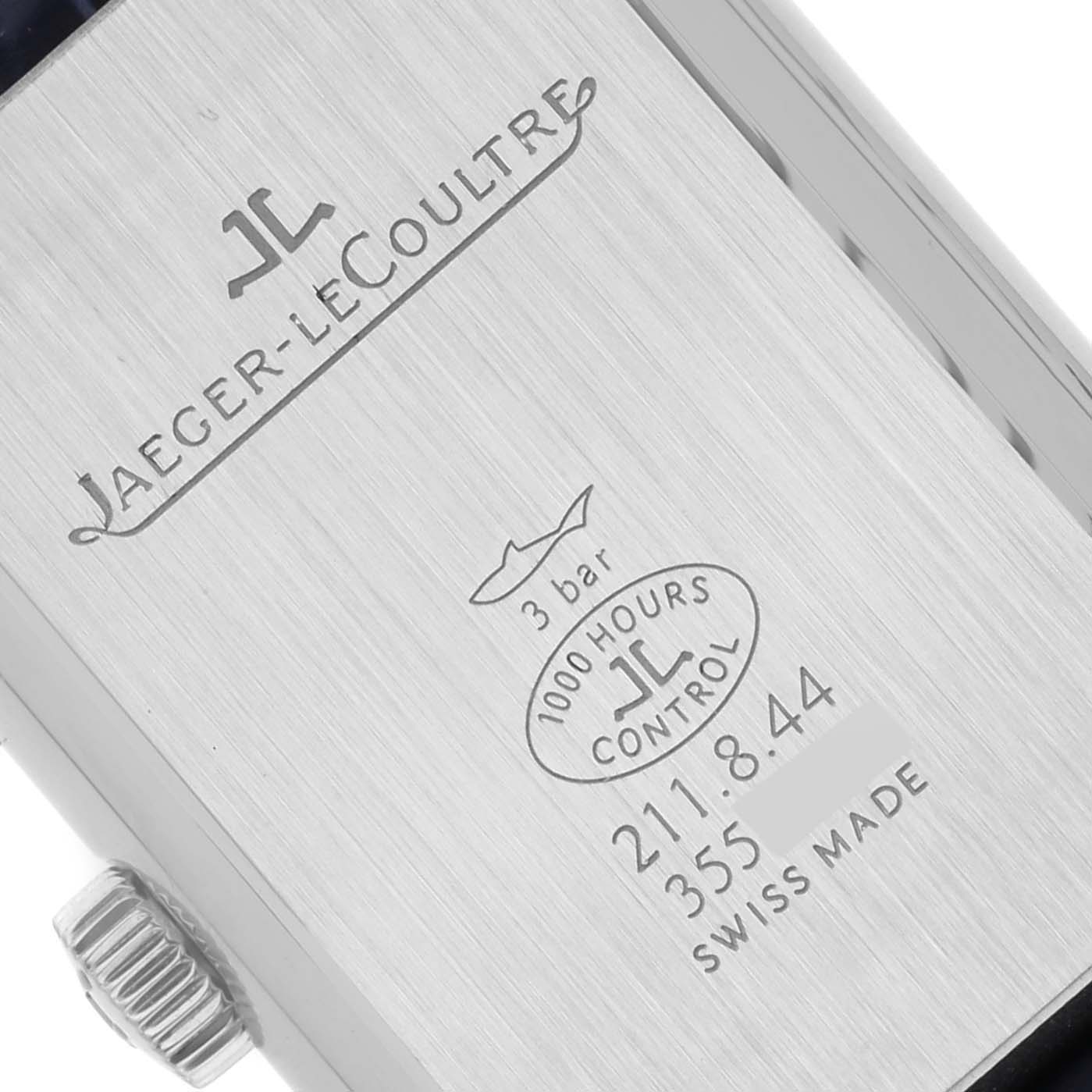 The image shows the back of a Jaeger LeCoultre Reverso Q2668432 Women's Stainless Steel Silver Dial Q2668432 Women's Stainless Steel Silver Dial watch, including the crown and various engravings.