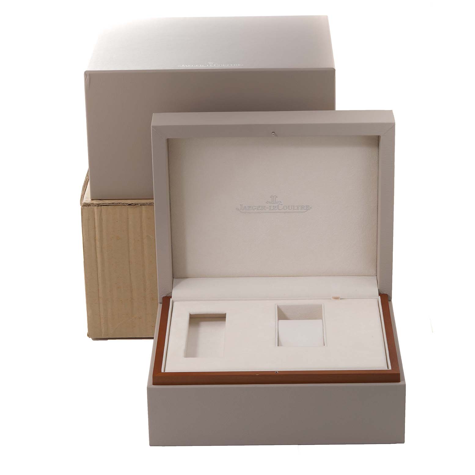 The image shows the packaging box for a Jaeger-LeCoultre Reverso watch, including an outer box and an open inner watch display box.