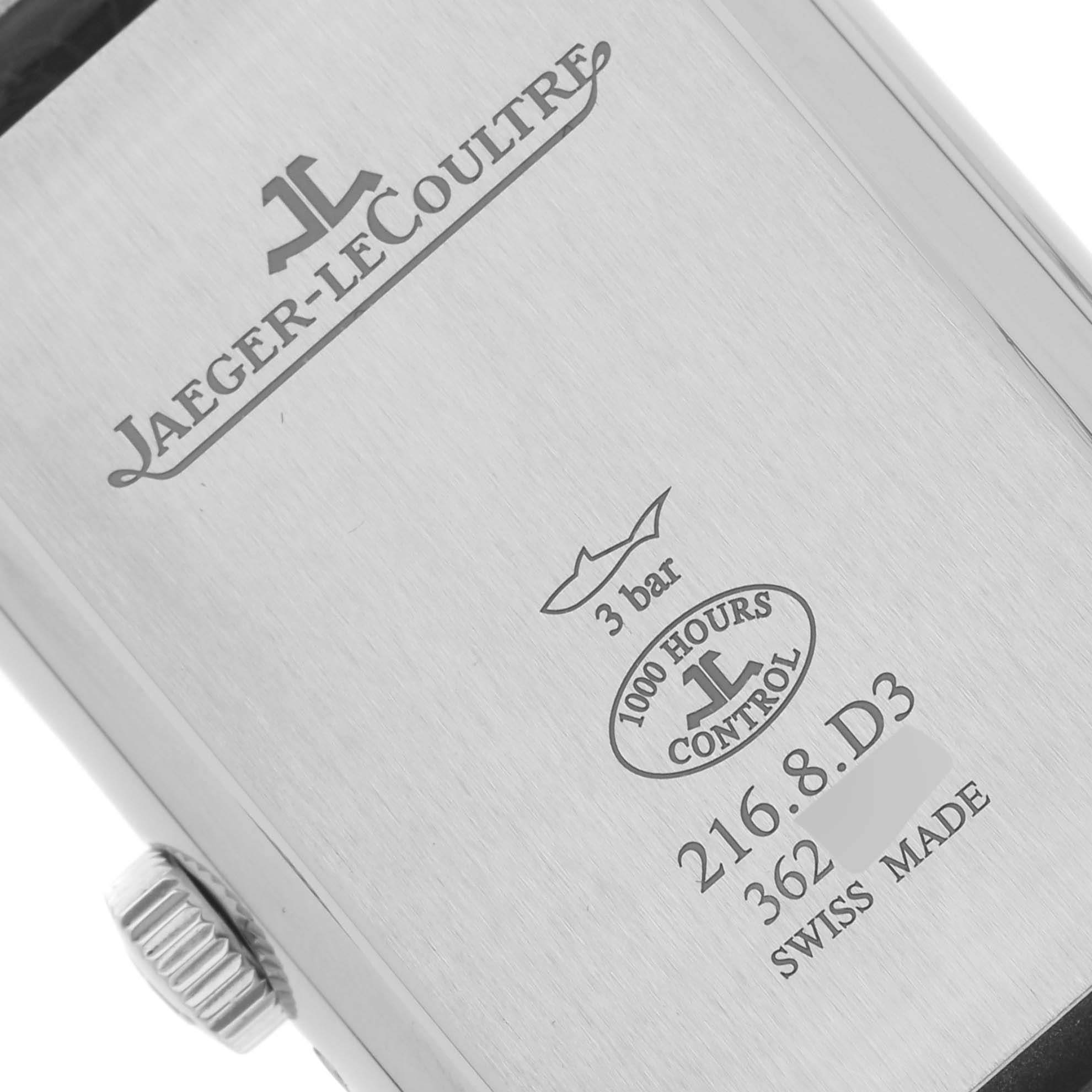 This image shows the engraved back panel and crown of a Jaeger-LeCoultre Reverso watch.