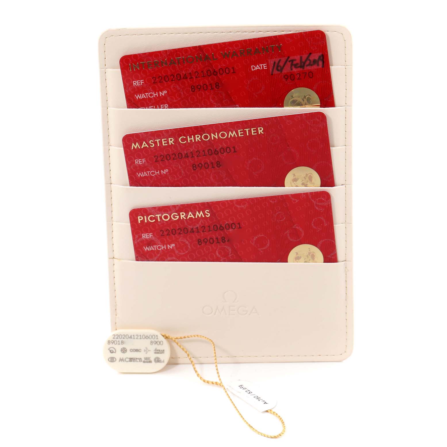 The image shows three red cards (International Warranty, Master Chronometer, and Pictograms) in a white cardholder for the Omega Aqua Terra 220.20.41.21.06.001 Men
s Steel and Gold (two tone) Grey Dial 220.20.41.21.06.001 Men
s Steel and Gold (two tone) Grey Dial watch.