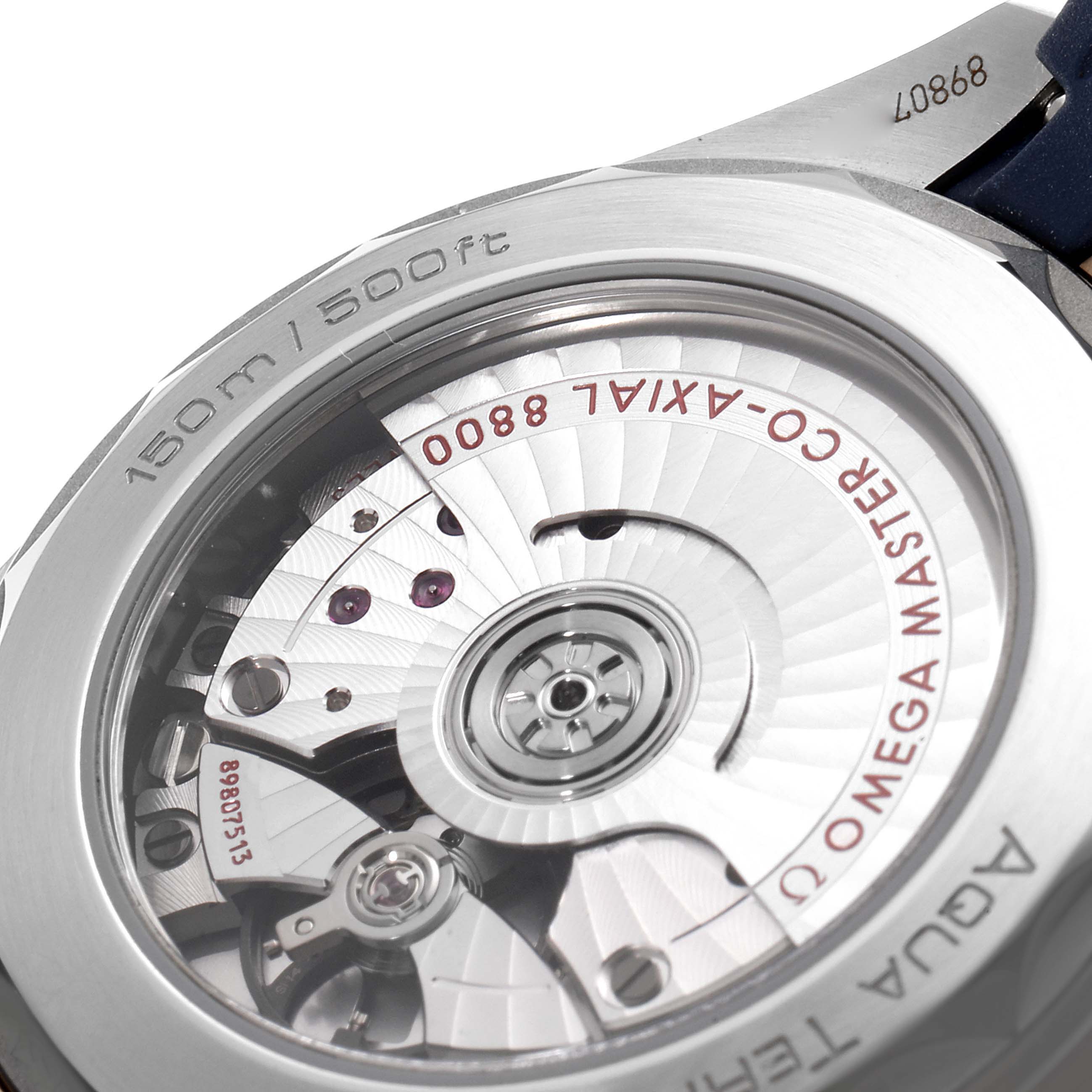 The image shows the back view of the Omega Aqua Terra 220.22.38.20.02.001 Men's Steel and Gold (two tone) Silver Dial 220.22.38.20.02.001 Men's Steel and Gold (two tone) Silver Dial watch, revealing the movement and internal components.